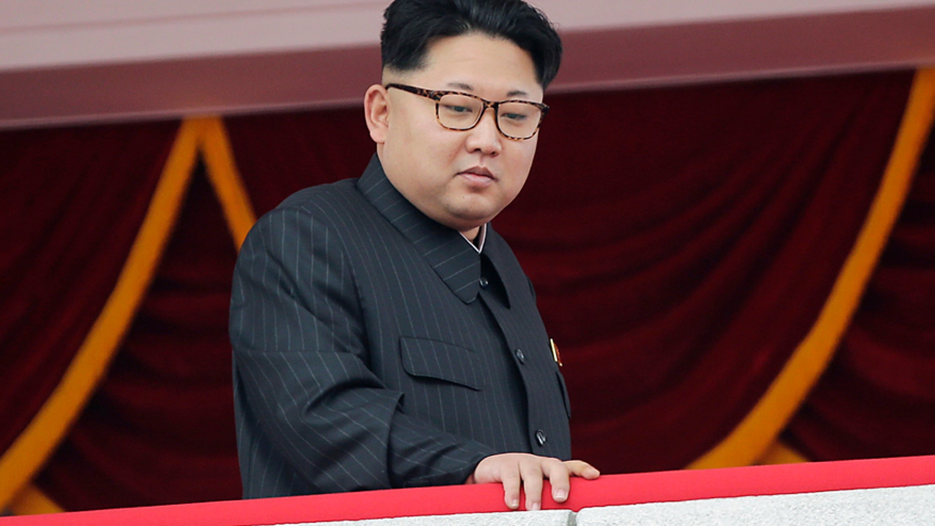 In this May 10, 2016, photo, North Korea's leader Kim Jong Un watches a parade from a balcony at the Kim Il Sung Square in Pyongyang.