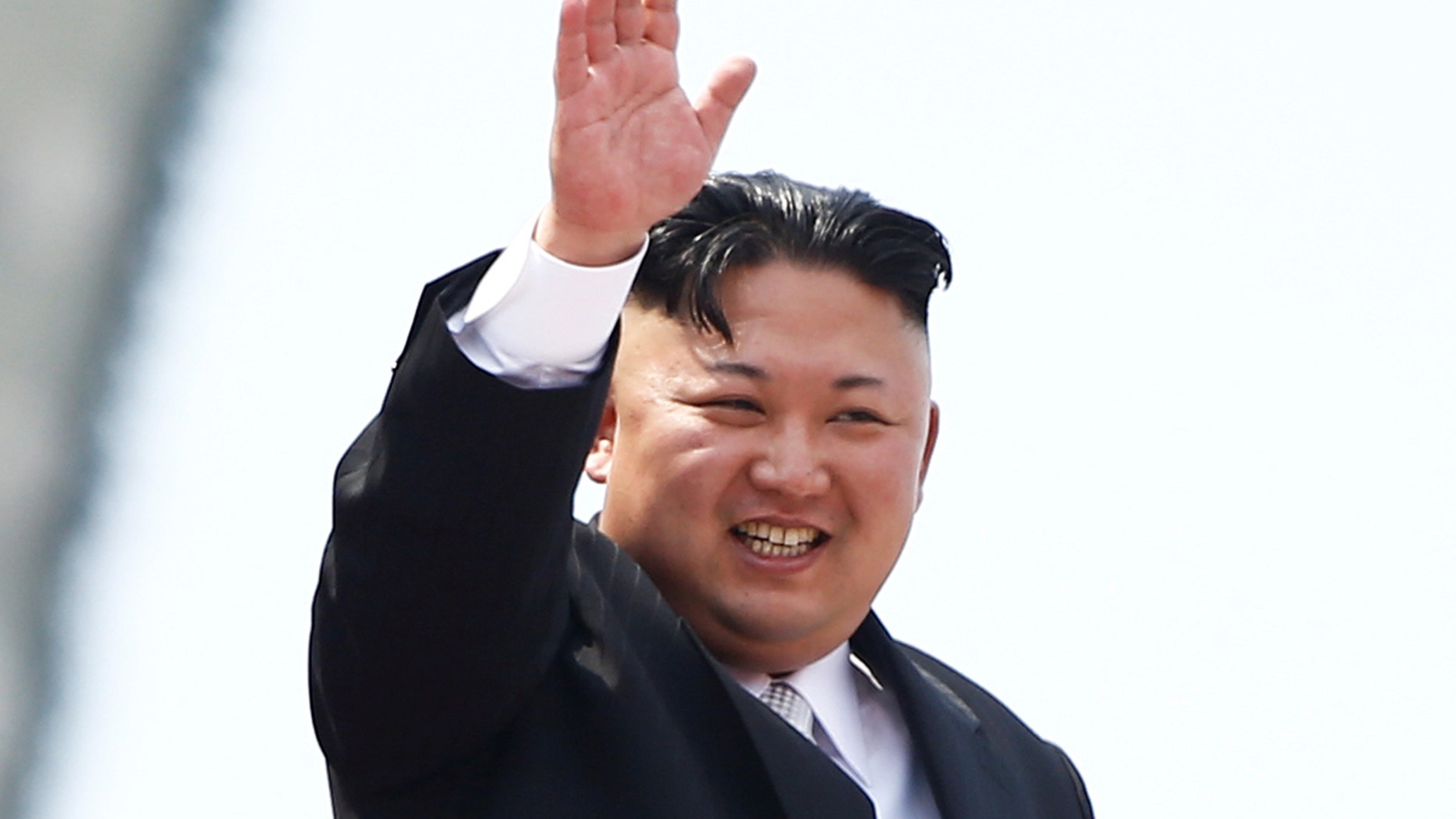 North Korean leader Kim Jong Un waves to people attending a military parade marking the 105th birth anniversary of country's founding father, Kim Il Sung in Pyongyang, April 15, 2017.