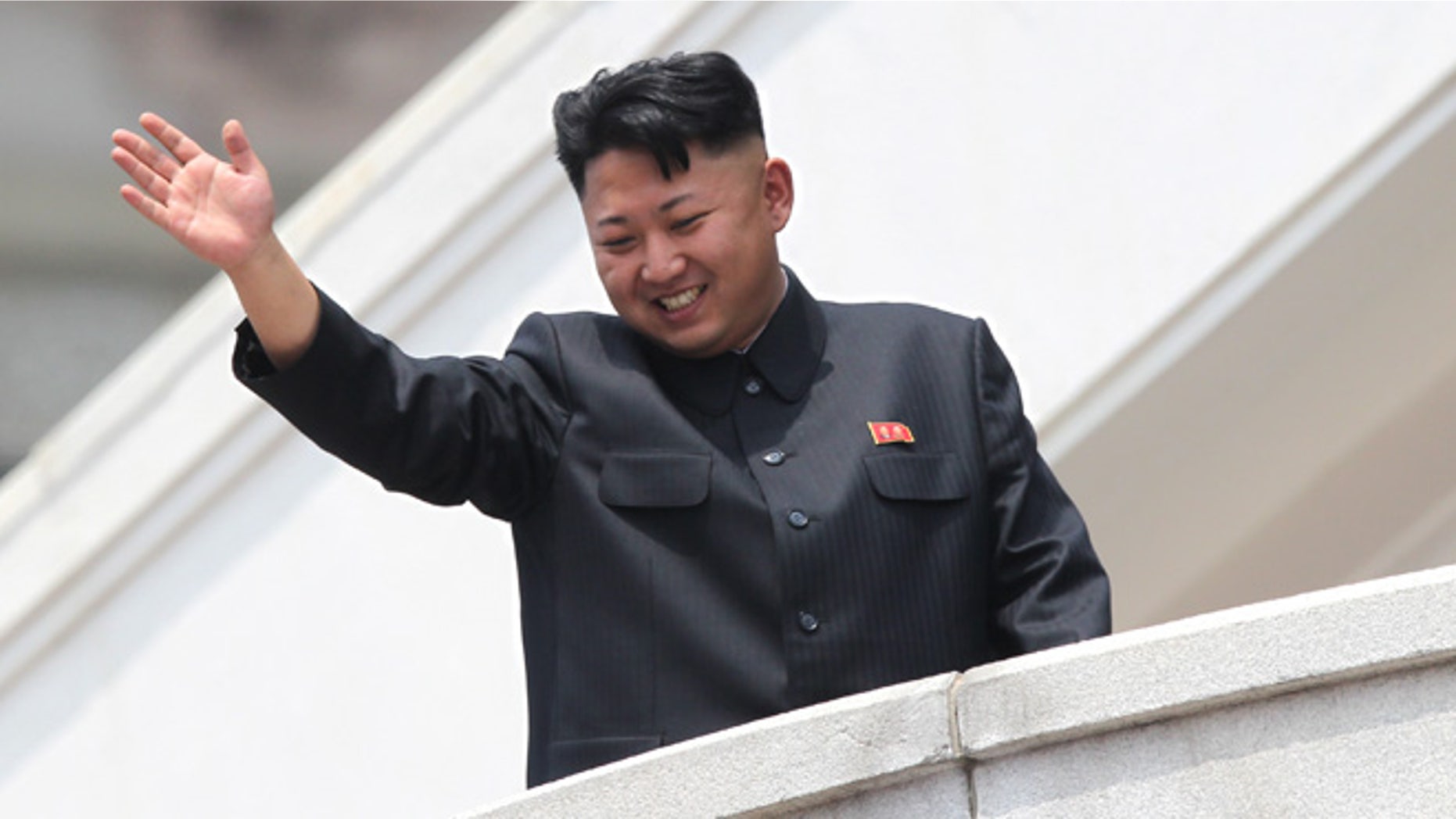 July 27, 2013: North Korean leader Kim Jong Un waves to war veterans during a mass military parade celebrating the 60th anniversary of the Korean War armistice in Pyongyang, North Korea. A Malaysian university faced public criticism Thursday for awarding an honorary doctorate in economics to North Korean leader Kim Jong Un, whose country is among the poorest in the world.