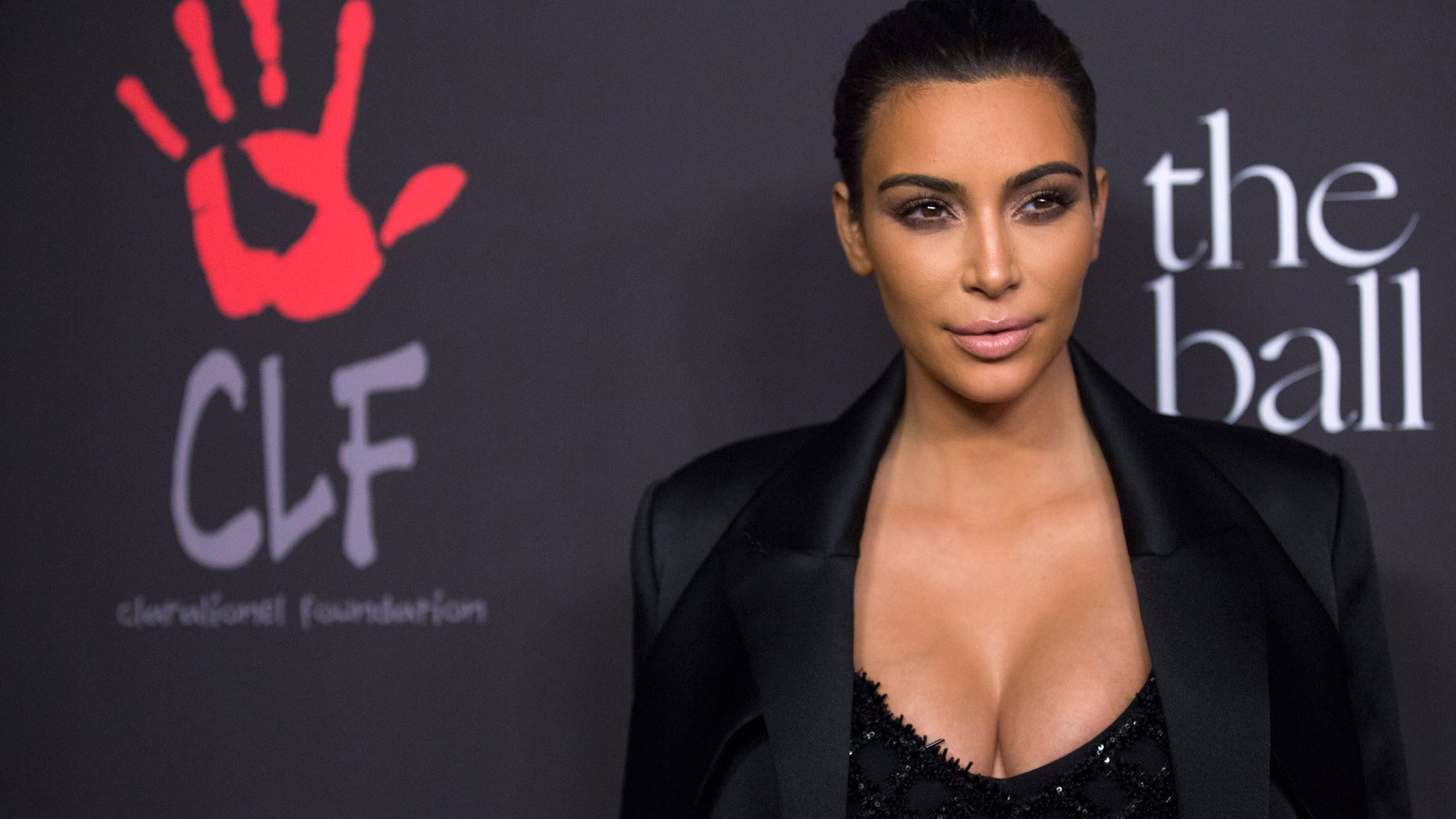 Dec 11, 2014. Television personality Kim Kardashian poses at the First Annual Diamond Ball fundraising event at The Vineyard in Beverly Hills, California.