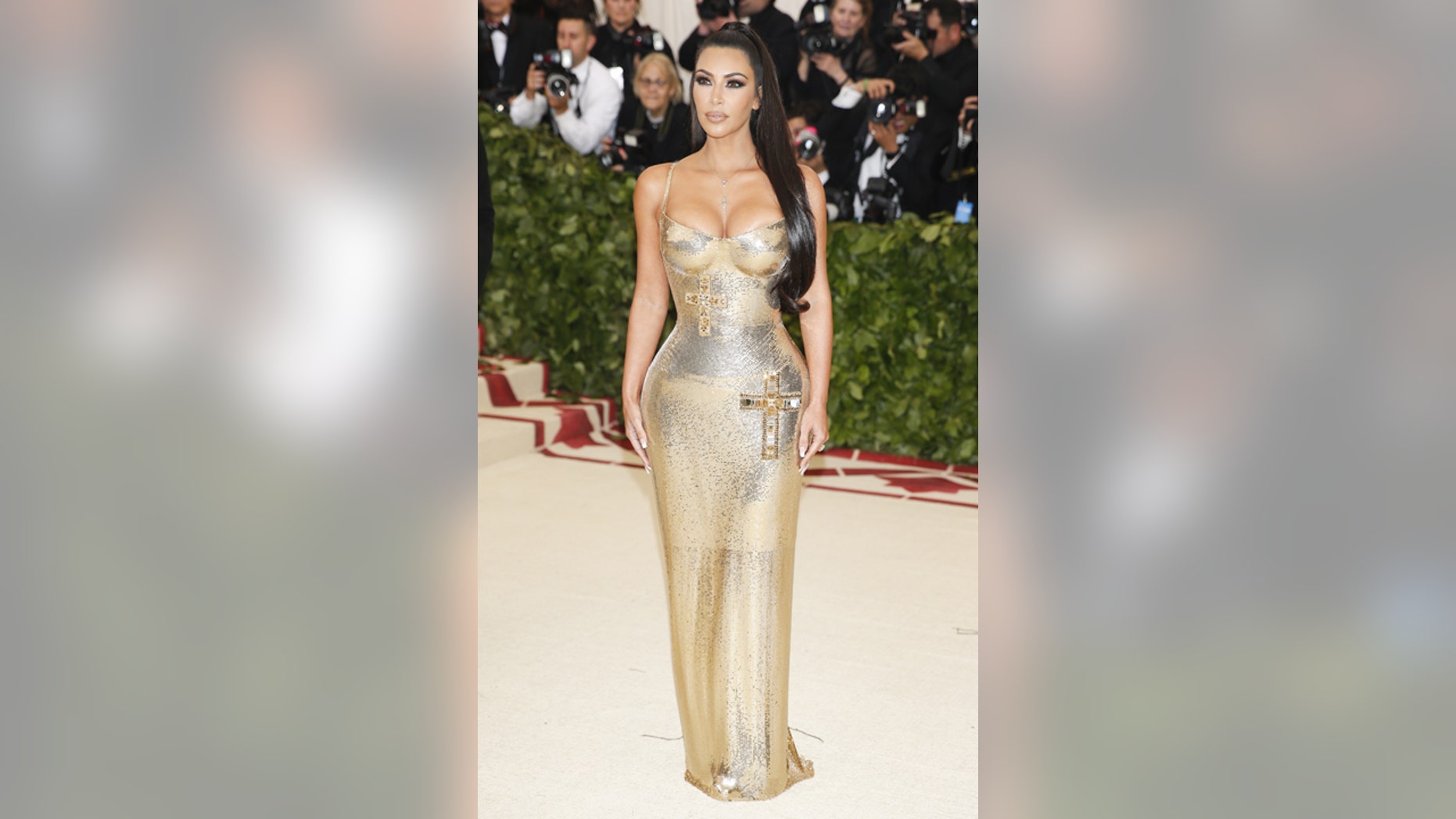 Kim Kardashian poses sans Kanye West at the Metropolitan Museum of Art Costume Institute Gala.