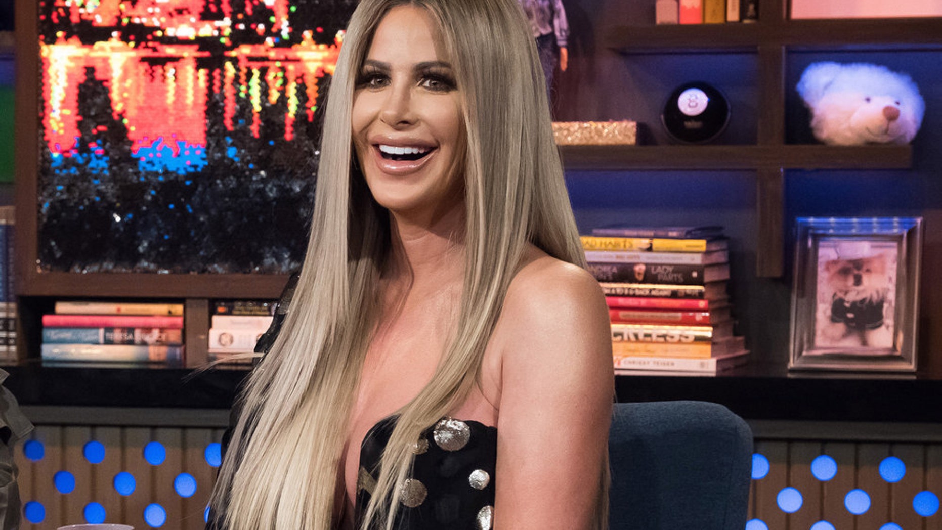 Kim Zolciak gifted her daughter Brielle a rose gold pistol for her 21st birthday.