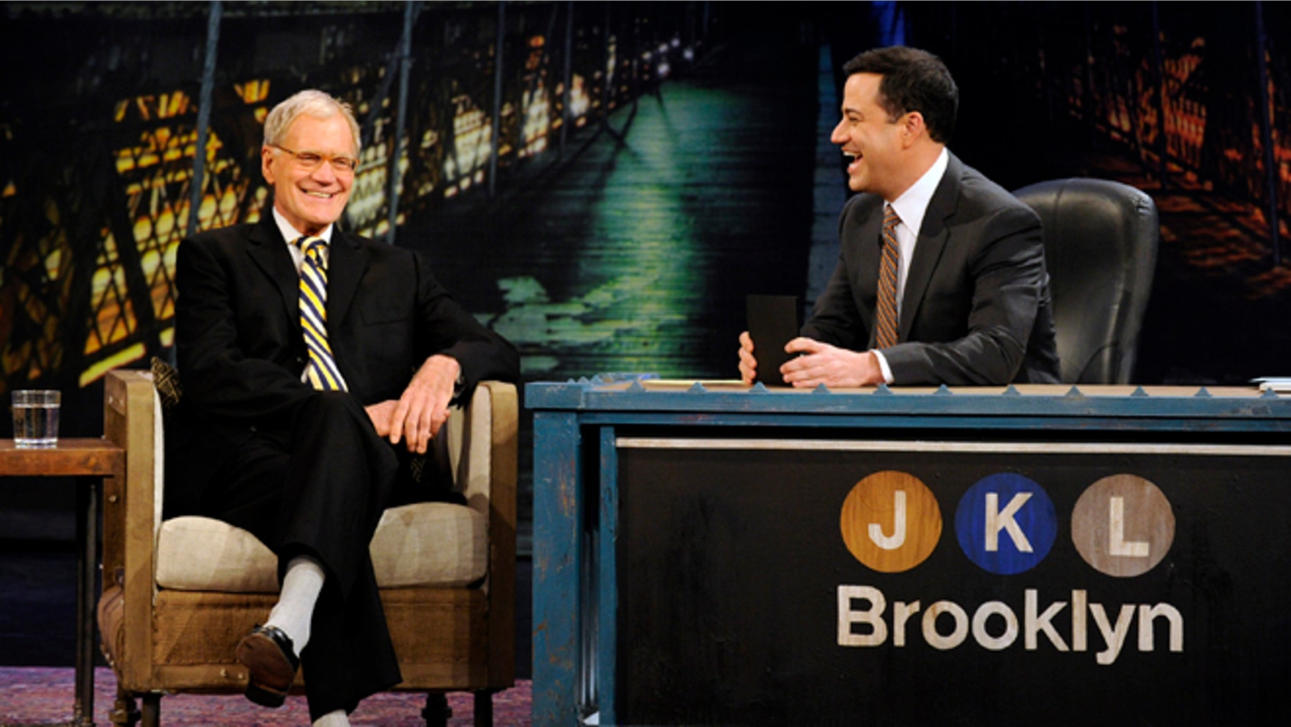 In this Oct. 31, 2012 photo released by ABC, host Jimmy Kimmel, right, speaks with guest David Letterman during "Jimmy Kimmel Live," in the Brooklyn borough of New York. New York's late-night TV hosts were back in swing, though, with all resuming regular production Wednesday. Kimmel, who usually broadcasts from Los Angeles, is doing a week of shows in Brooklyn.