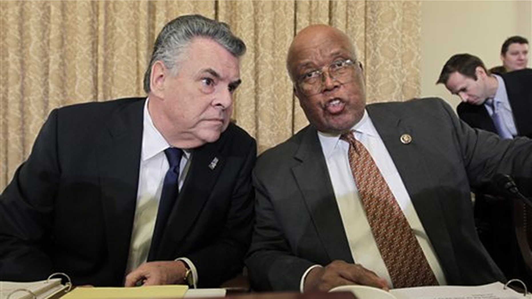 Rep. Peter King, left, chairman of the House Homeland Security Committee, talks to Rep. Bennie Thompson, the top Democrat on the committee, on Capitol Hill March 10.