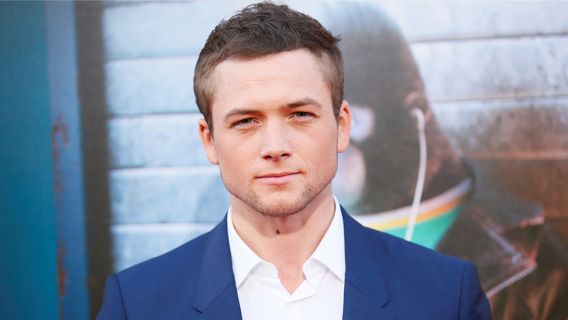 Actor Taron Egerton poses at the world premiere of the film "Sing" in Los Angeles, California, December 3, 2016. REUTERS/Danny Moloshok - RTSUJBM