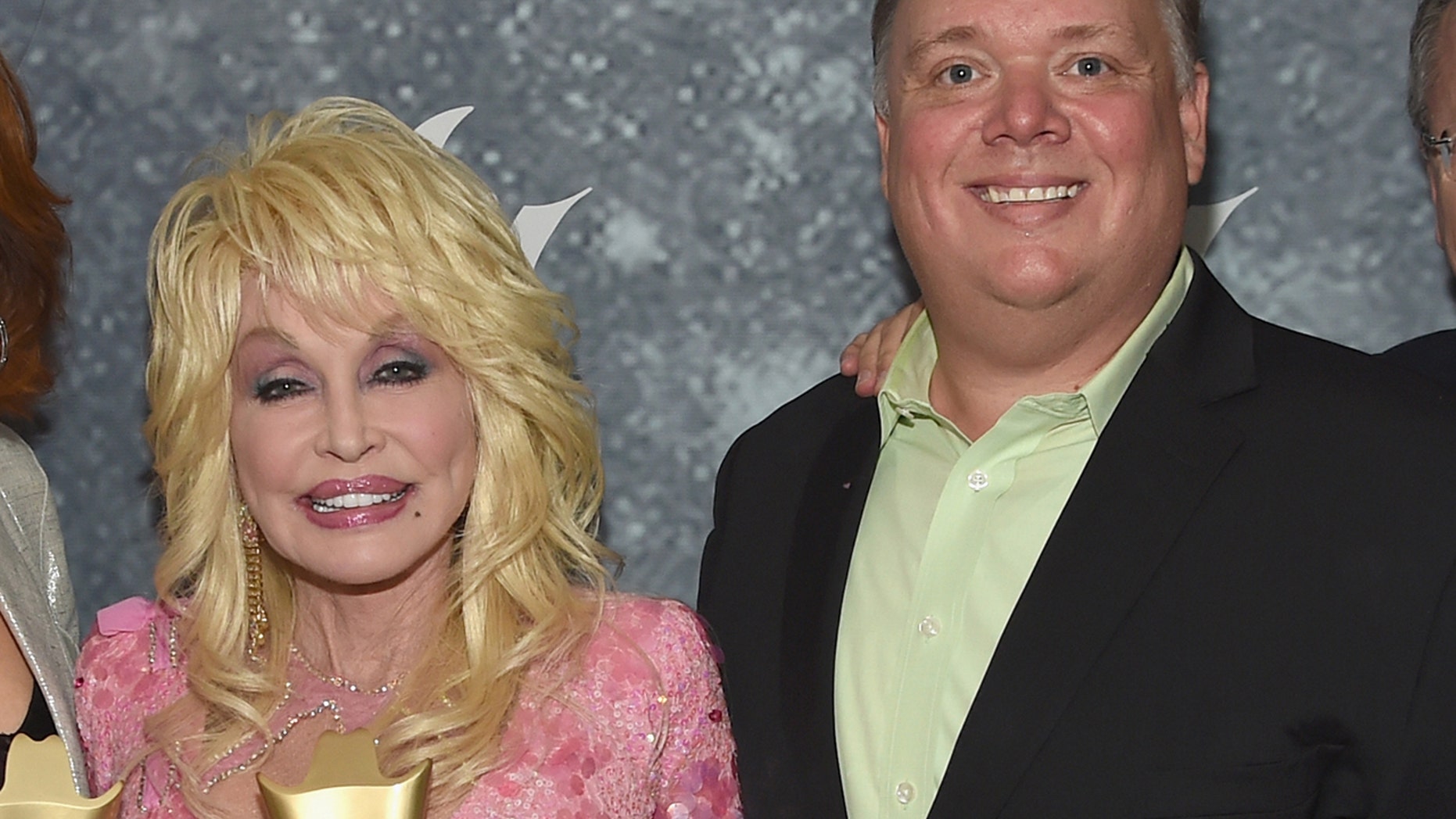 Dolly Parton (l) has parted ways with longtime publicist Kirt Webster (r) after the former PR powerhouse was accused of sexual assault and harassment by former clients and employees.