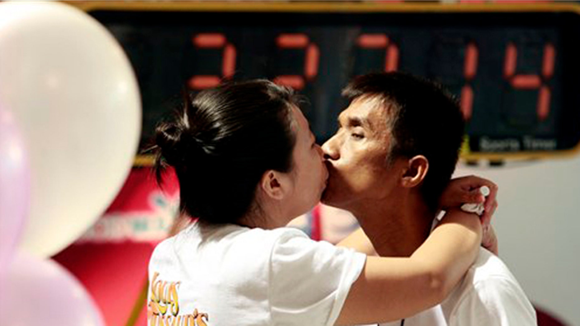 Feb. 13: Competitors, Laksana Tinarat, left, kisses her husband Ekachai during a World's Longest Continuous Kiss competition in Pattaya, southeastern Thailand. The event was held in an attempt to break the Guinness world record and to celebrate St. Valentine's Day. (AP)