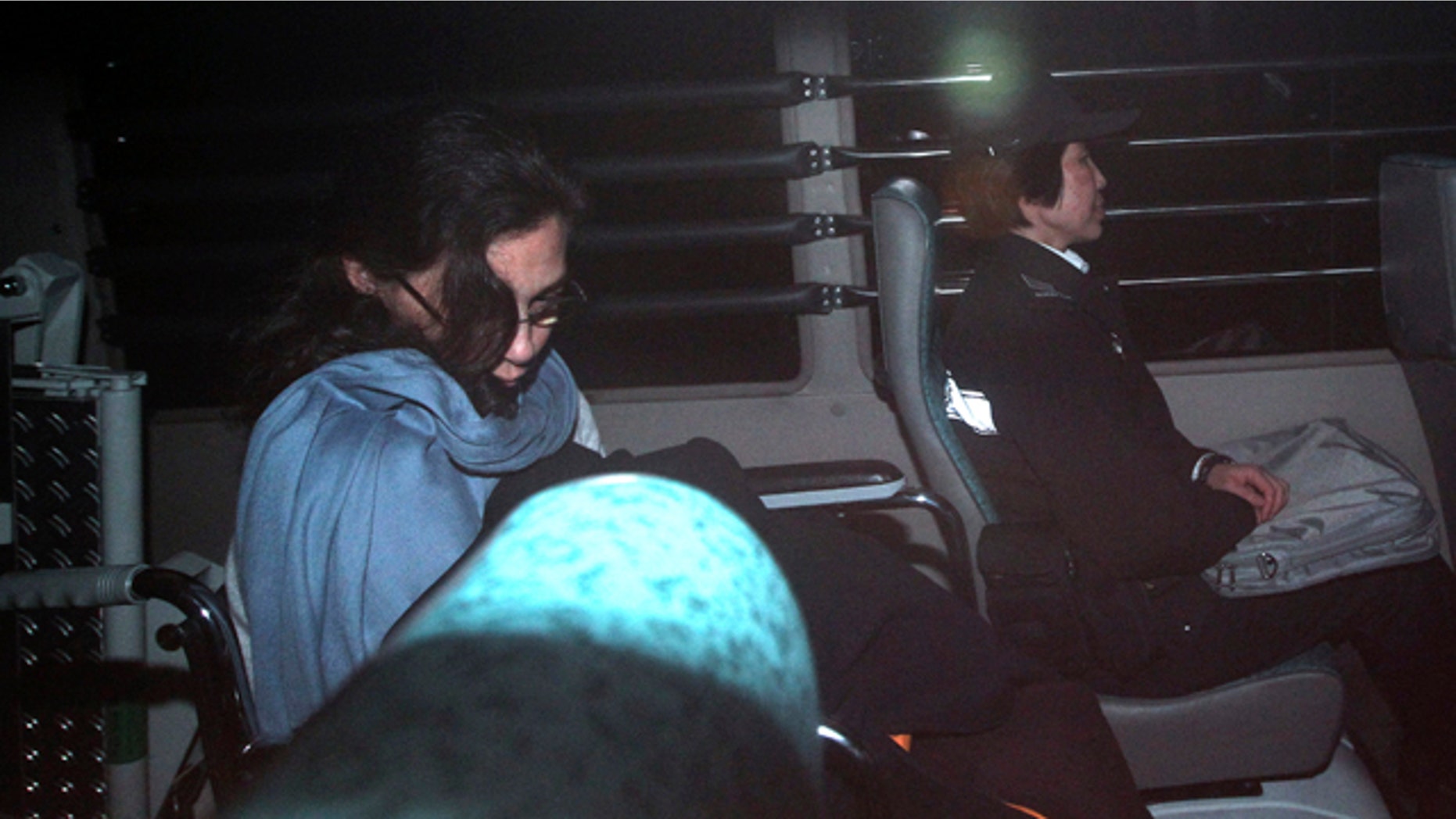 March 24: Nancy Kissel, left, an American woman accused of killing her husband, leaves the High Court by a prison van in Hong Kong. A Hong Kong jury is deliberating in the retrial of Kissel accused of murdering her wealthy husband after drugging his milkshake. (AP)