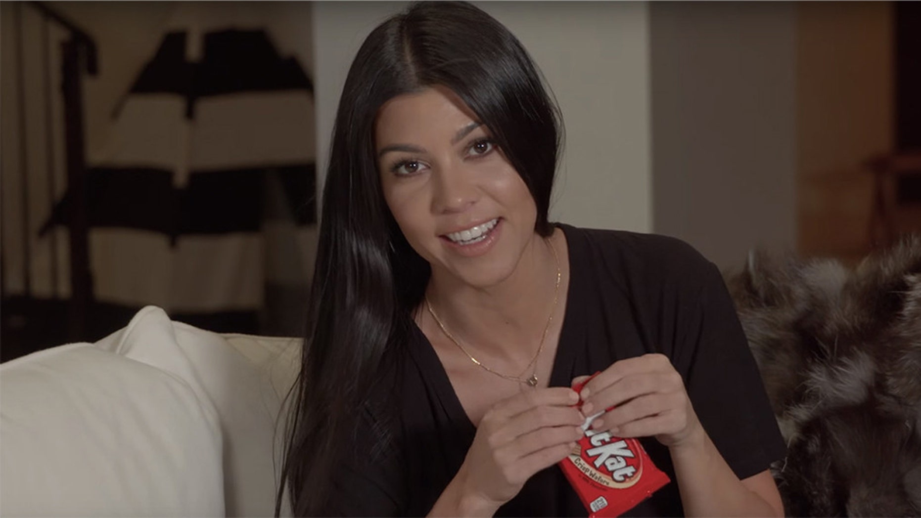 "Give me a break!" Kourtney Kardashian show how to eat a single Kit Kat bar in 6 steps.