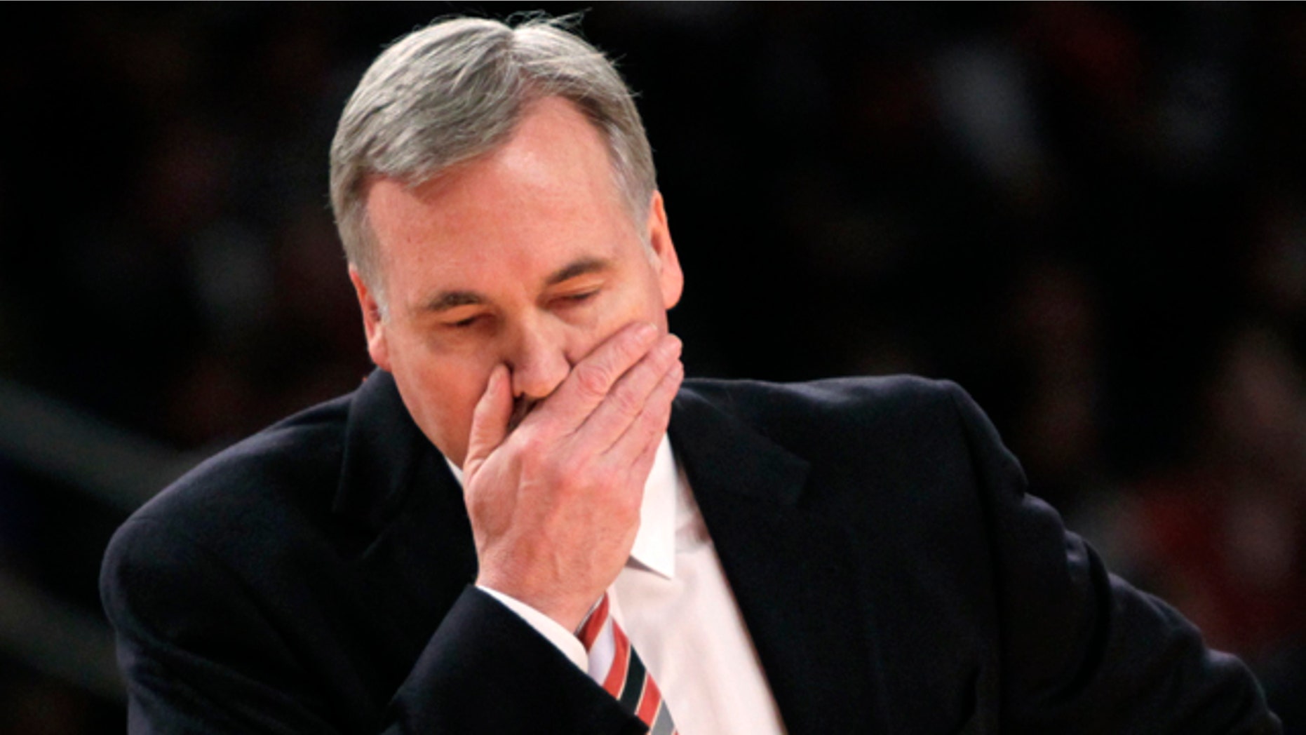 New York Knicks' head coach Mike D'Antoni walks onto the court during a time out during the first half of an NBA basketball game against the Philadelphia 76ers in New York, Sunday, March 11, 2012. The 76ers defeated the Knicks 106-94. (AP Photo/Seth Wenig)
