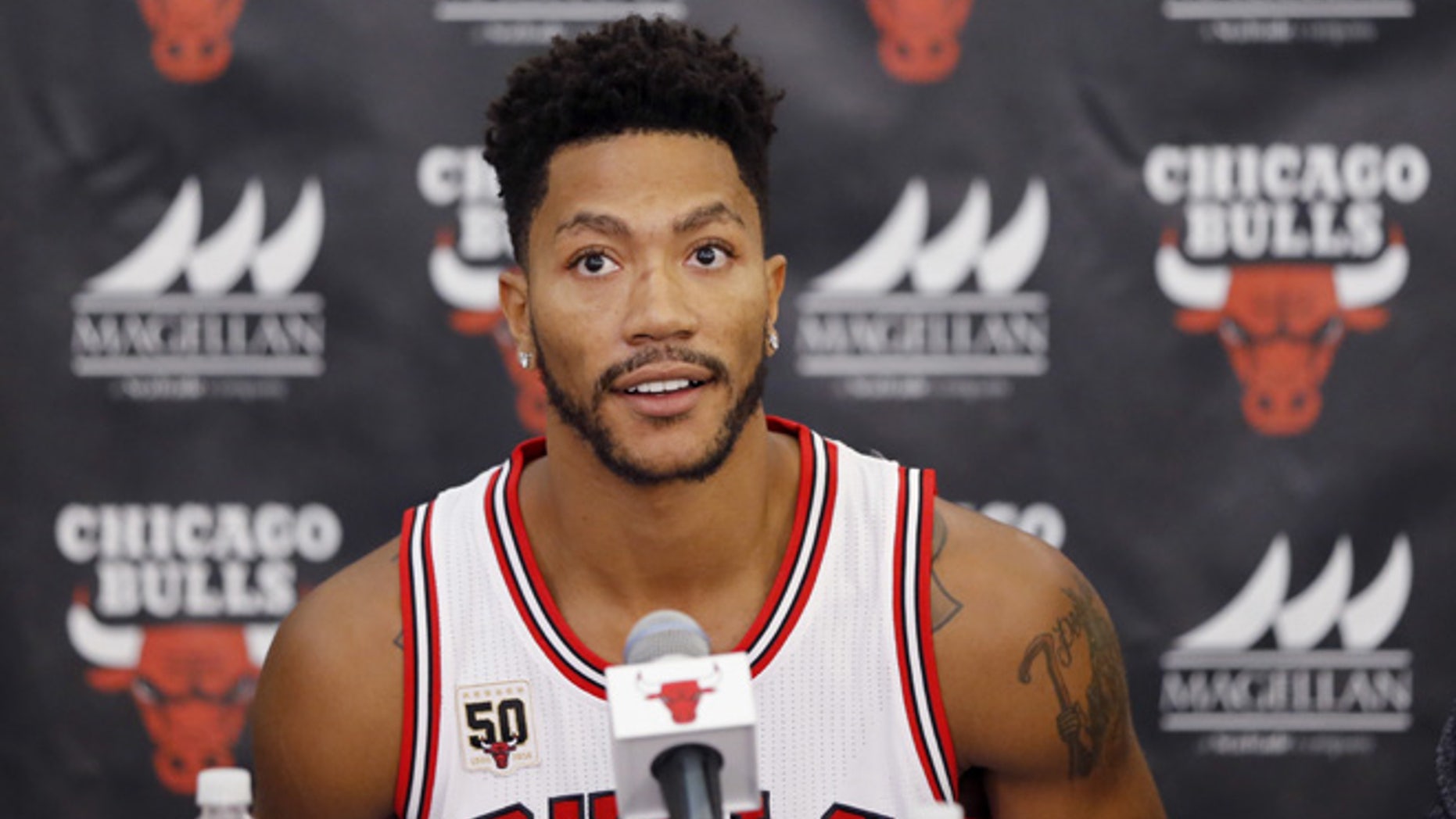 FILE - In this Sept. 28, 2015, file photo, Chicago Bulls' Derrick Rose sits down for an NBA basketball media day news conference in Chicago. (AP Photo/Charles Rex Arbogast, File)