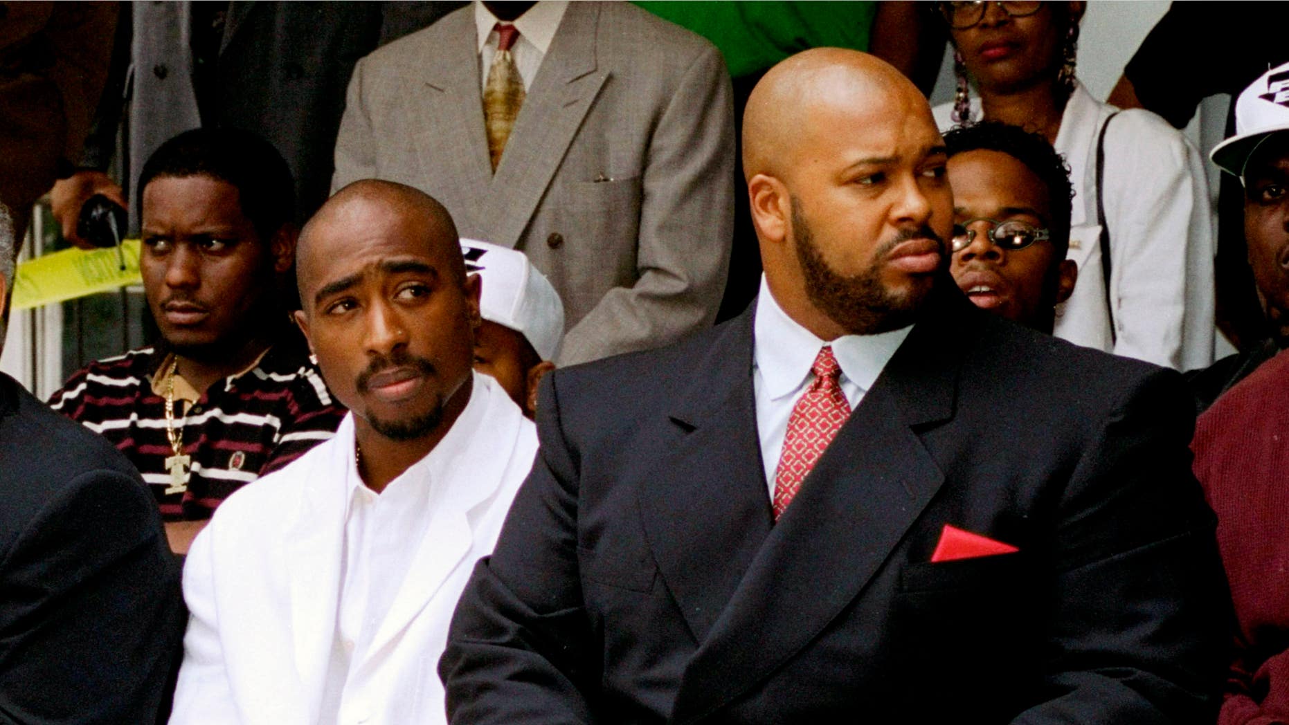 Aug. 15, 1996: Tupac Shakur, left, and a founder of Death Row Records, Marion "Suge" Knight, attend a voter registration event in South Central Los Angeles.