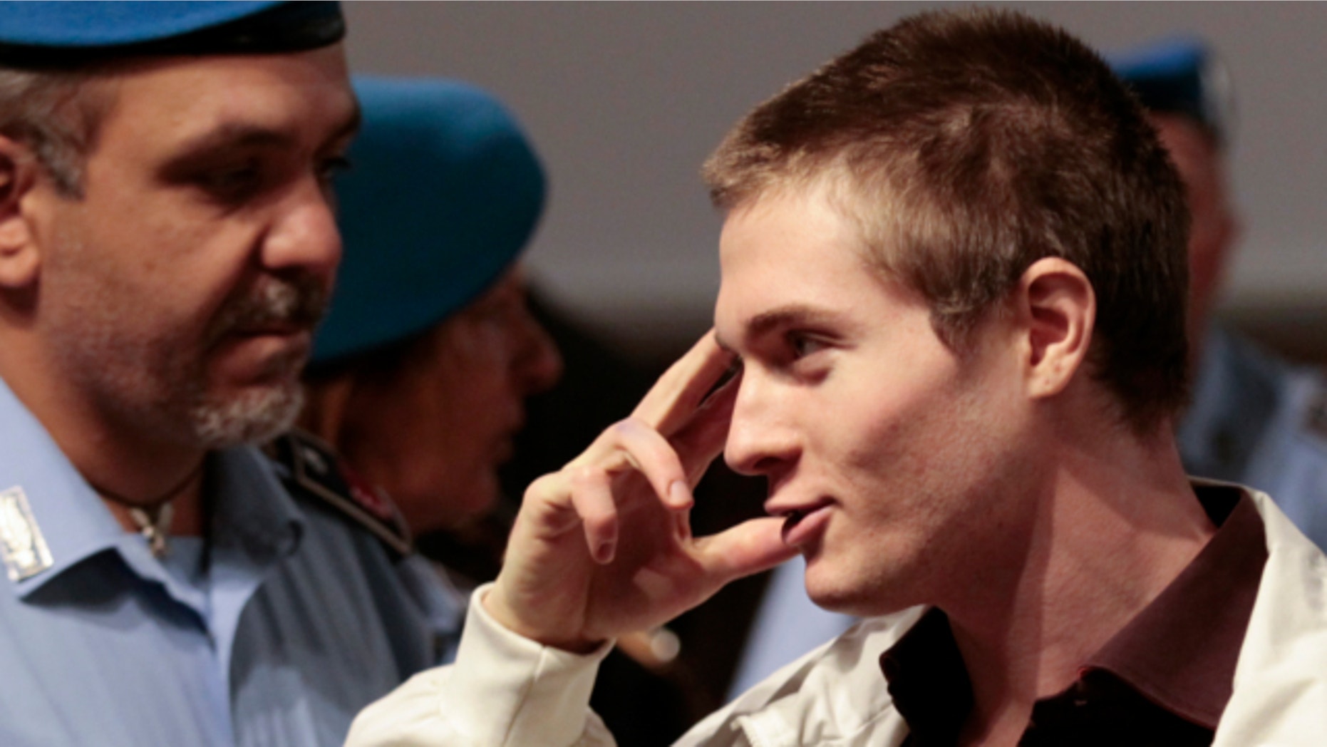 October 3, 2011: Raffaele Sollecito, the Italian student who was tried in the murder of Meredith Kercher in Italy in November 2007, gestures as he arrives for his appeal trial session in Perugia.