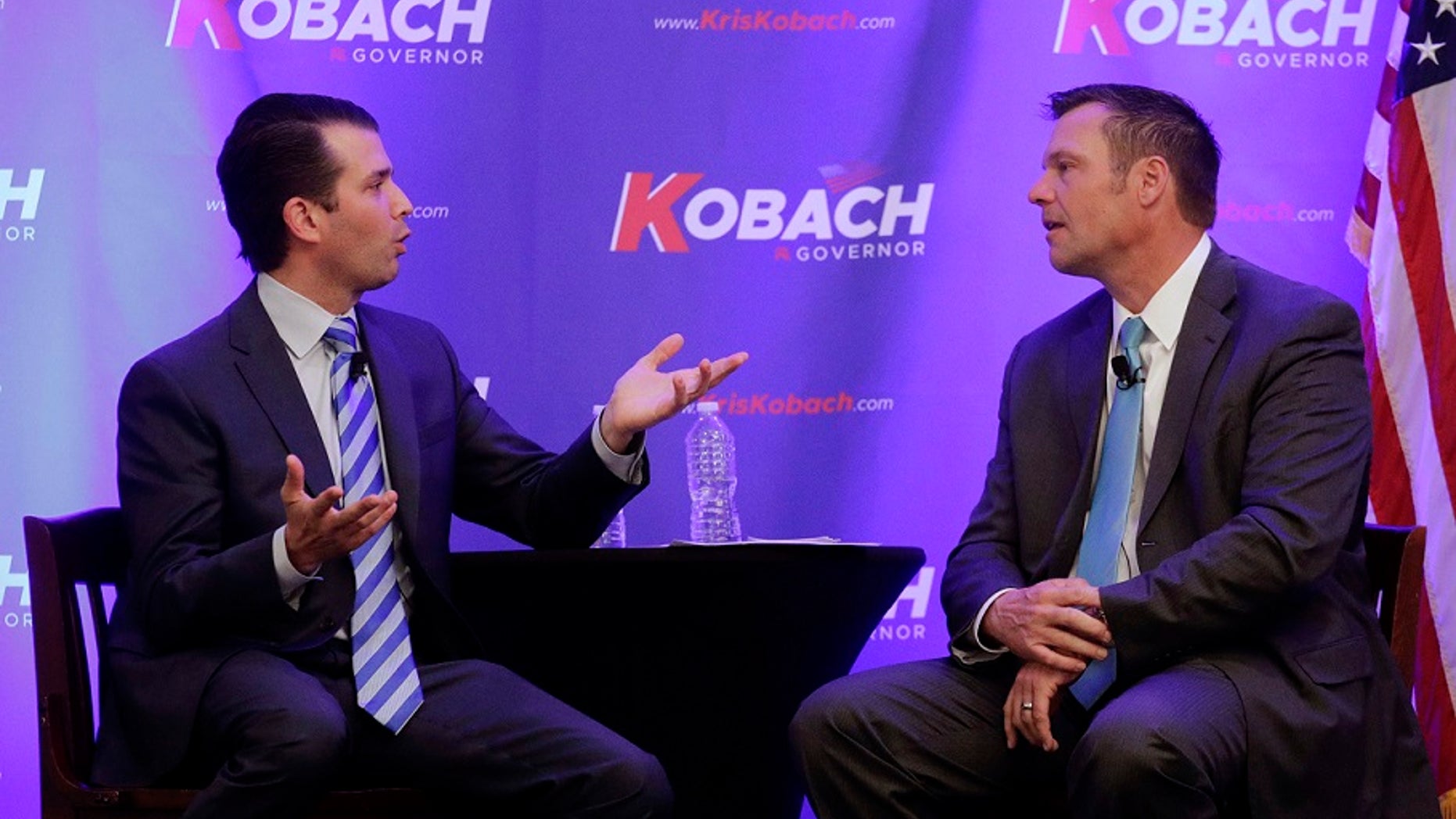 Donald Trump Jr., left, and Kansas gubernatorial candidate Kris Kobach talk during a fundraiser for Kobach's campaign, Nov. 28, 2017.