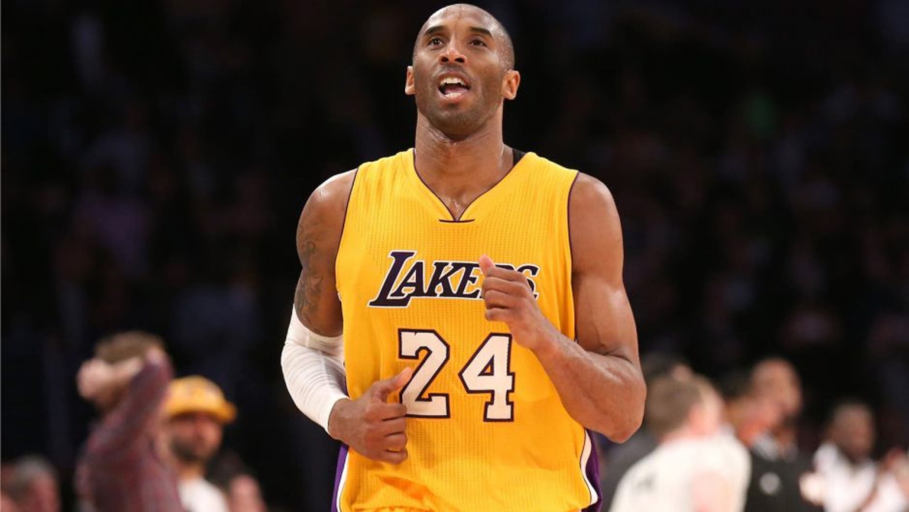 LOS ANGELES, CA - JANUARY 13: Kobe Bryant #24 of the Los Angeles Lakers reacts as he runs off the court after missing his three point attempt to tie the score as time ran out in the game against the Miami Heat at Staples Center on January 13, 2015 in Los Angeles, California. The Heat won 78-75. NOTE TO USER: User expressly acknowledges and agrees that, by downloading and or using this photograph, User is consenting to the terms and conditions of the Getty Images License Agreement. (Photo by Stephen Dunn/Getty Images)
