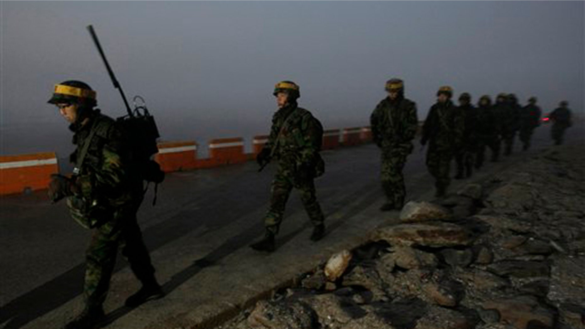 Dec. 19: South Korean Marines patrol along the coast on Yeonpyeong island, South Korea. A U.S. governor visiting North Korea called for it to show maximum restraint to planned South Korean military drills and hoped the U.N. Security Council would deliver the same message strongly as well, his office said.