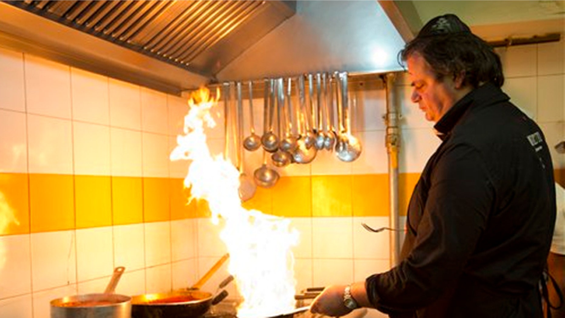 Ba'Ghetto restaurant co-owner and chef Ilan Dabush cooks.