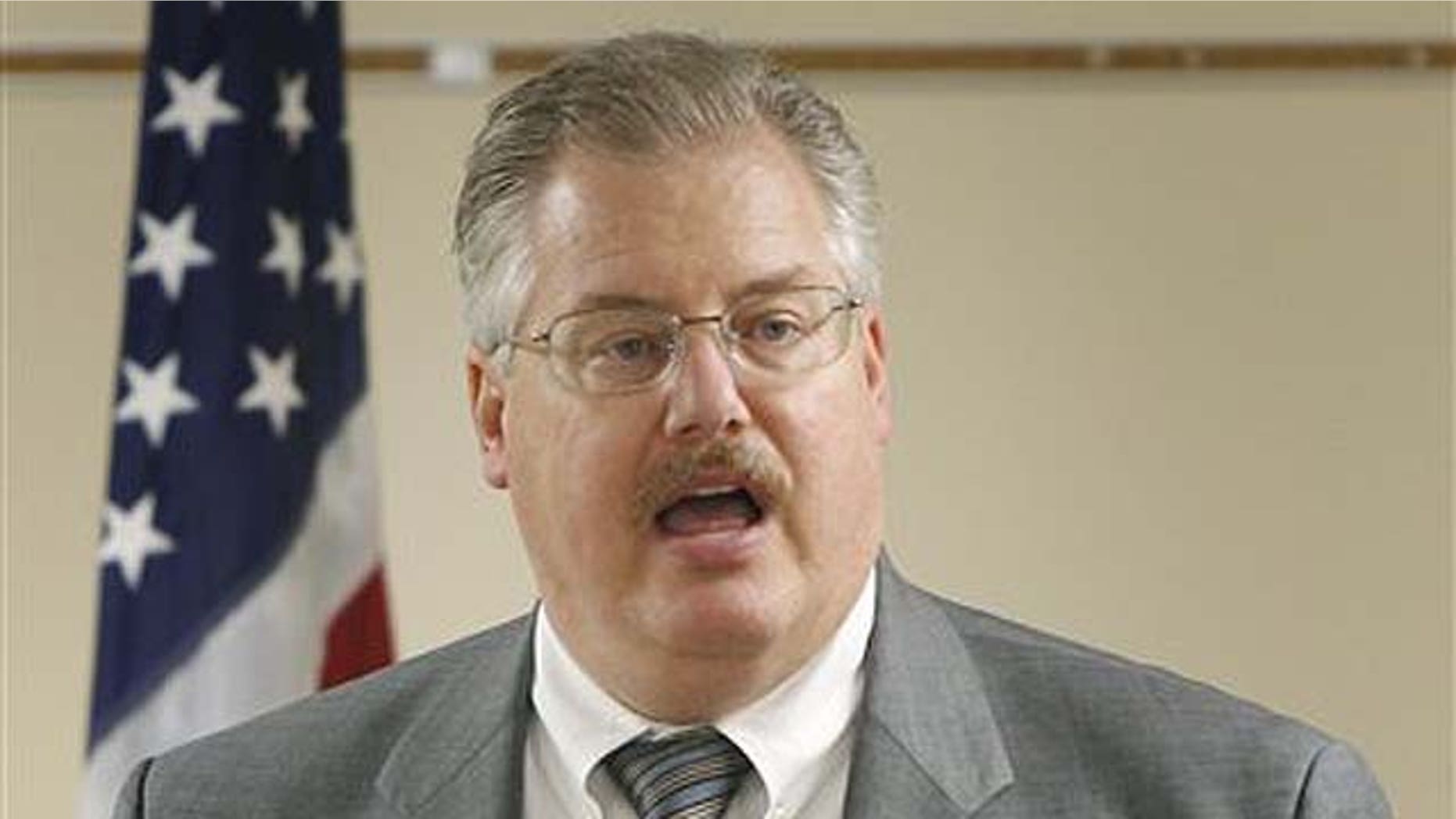 Sept. 17: Calumet County Dist. Atty. Ken Kratz, reads from a prepared statement, announcing that he will not be stepping down from his position during a news conference at the Calumet County Courthouse in Chilton, Wis. Kratz has shown in the two days since acknowledging he sent 30 text messages in three days to the 26-year-old woman last October. In one, he asked whether she was "the kind of girl that likes secret contact with an older married elected DA."