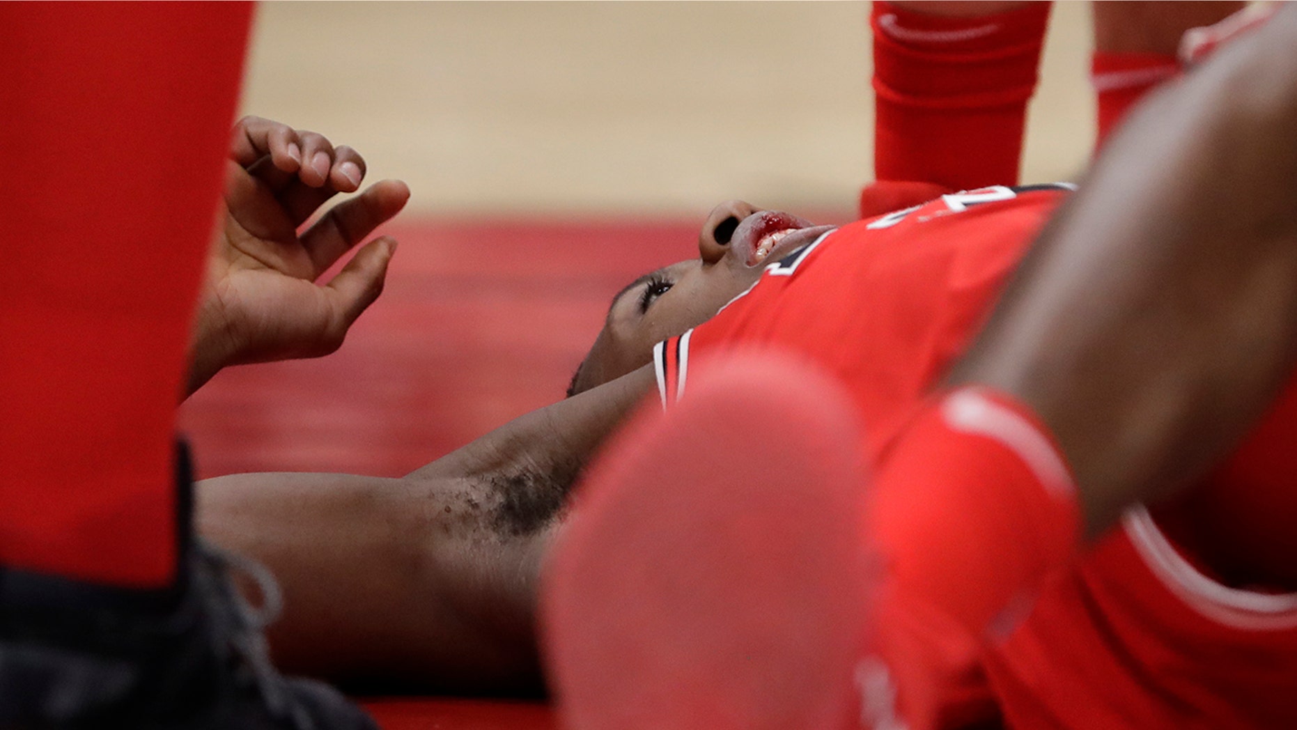 Jan. 17: Chicago Bulls' Kris Dunn lays on the floor after hitting his face on the floor during a game against the Golden State Warriors.