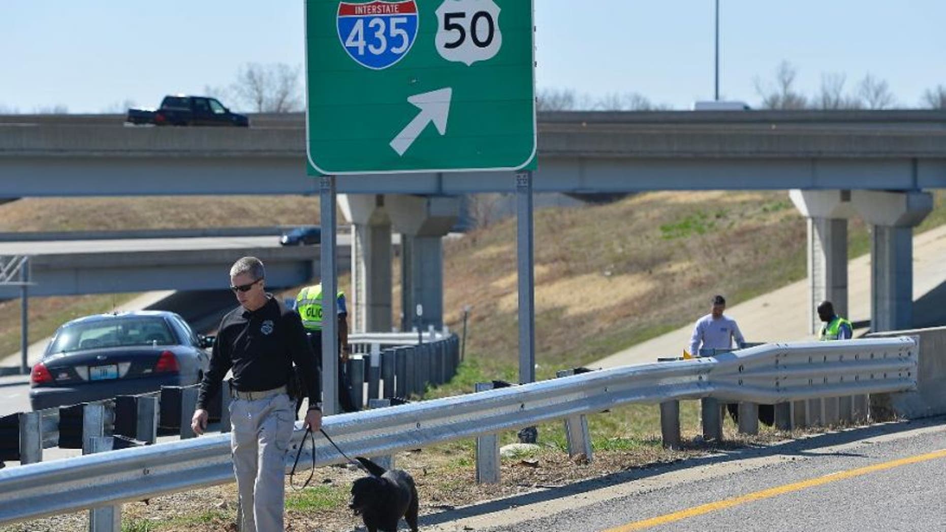 April 9, 2014: Kansas City police and agents from the Alcohol, Tobacco and Firearms with canines investigated a shooting along southbound Interstate 435 in Kansas City, Mo.