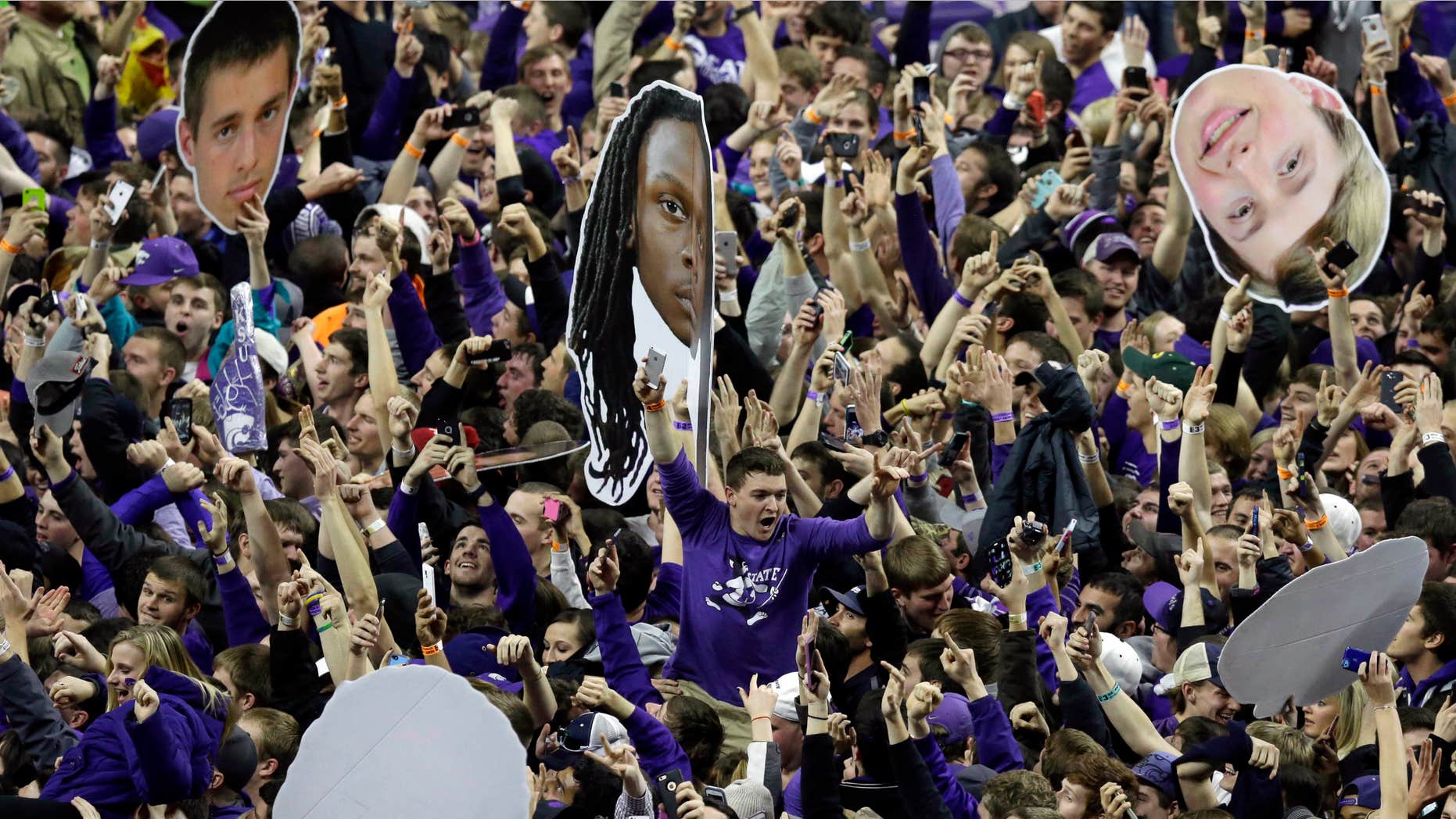 Feb. 23, 2015: Kansas State fans celebrate victory following an NCAA college basketball game against Kansas at Bramlage Coliseum in Manhattan, Kan.
