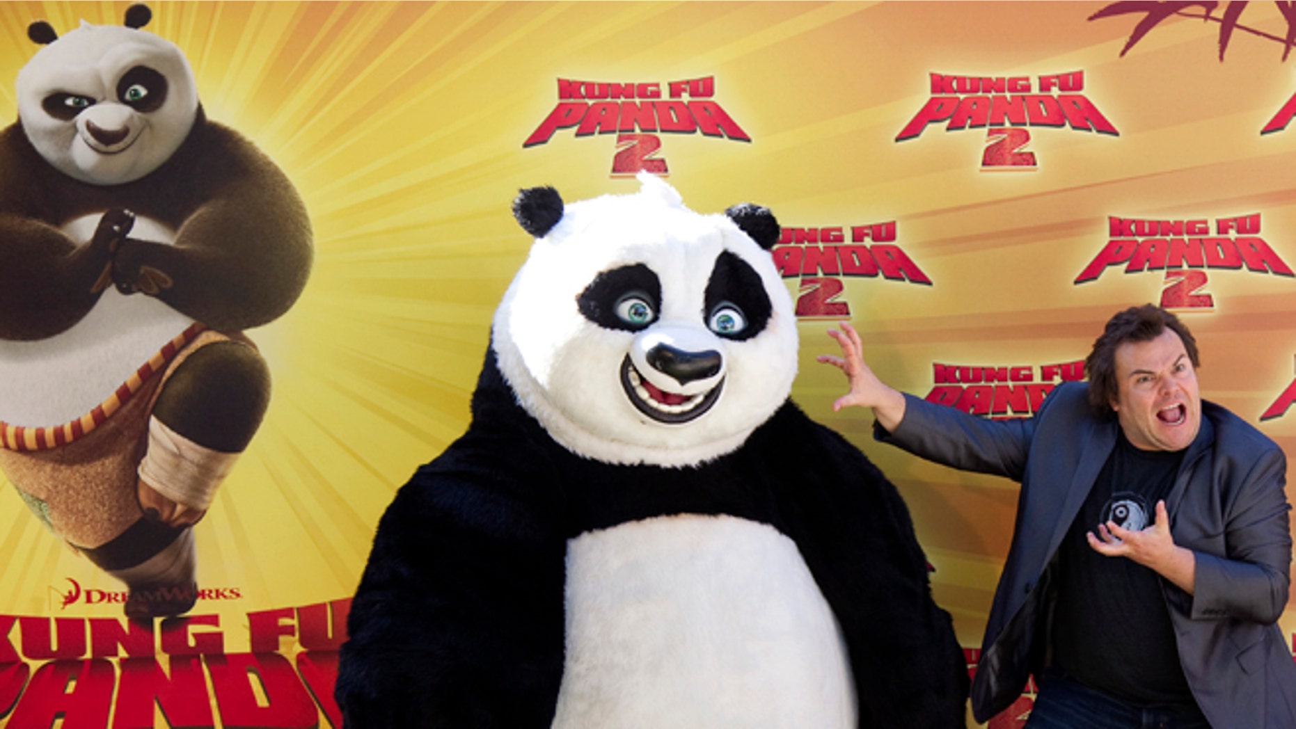 June 10, 2011: Actor Jack Black poses with a costumed 'Kung Fu Panda' at a promotional event in Madrid.