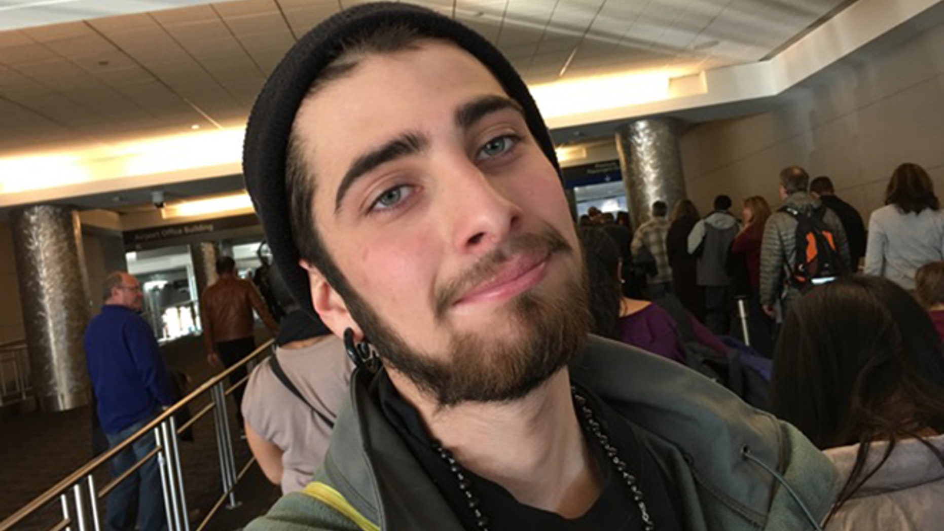 In this Jan. 10, 2016, family photo made available Wednesday, Aug. 10, 2016, by Robert MacTaggart, Jordan MacTaggart is shown in a photograph made by his father Robert at Denver International Airport in Denver.