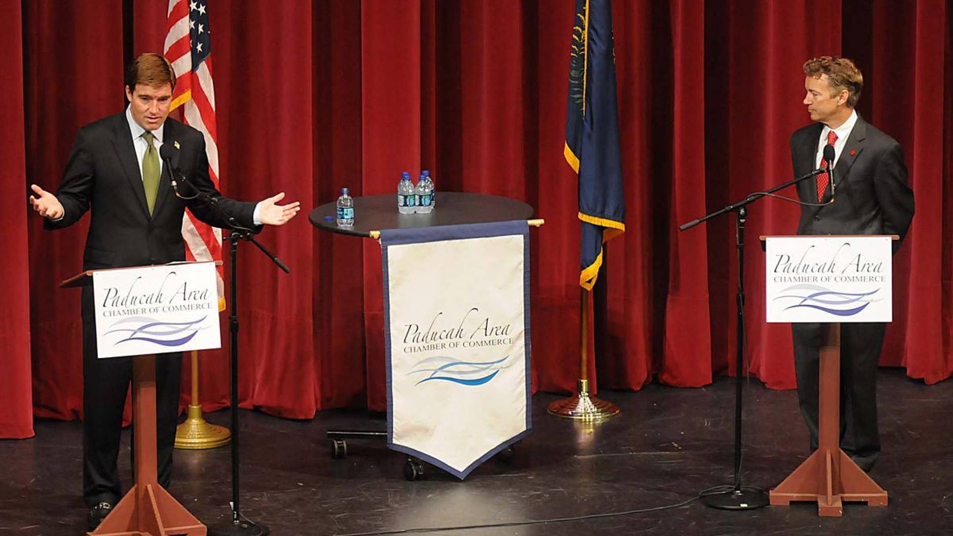 Jack Conway, a Democrat running for Kentucky U.S. Senate, left, gestures as he speaks during a debate with Republican opponent Rand Paul Thursday, Oct. 14, 2010 at the Luther F. Carson Four Rivers Center in Paducah, Ky. (AP Photo/The Paducah Sun, John Wright)