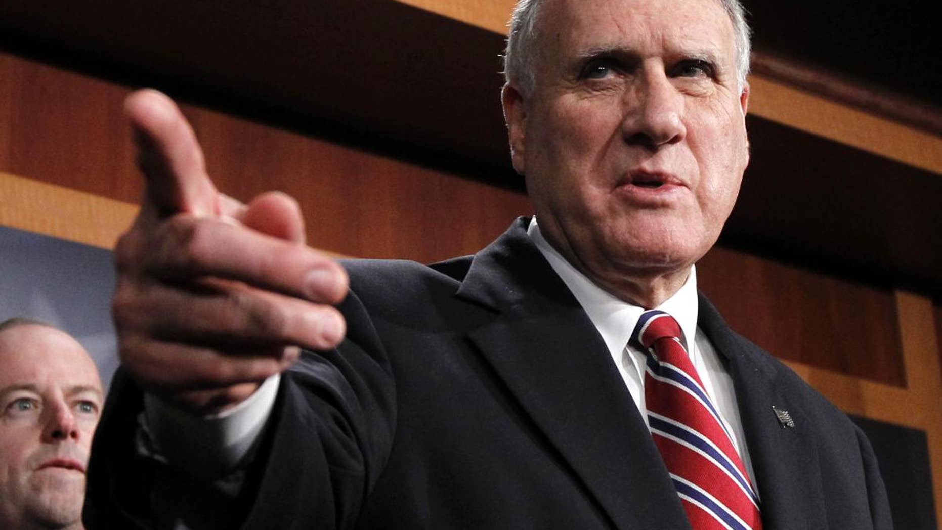 Senate Minority Whip Jon Kyl of Ariz., left, accompanied by Sen. George LeMieux, R-Fla., gestures during a news conference on Capitol Hill in Washington, Wednesday, Dec. 15, 2010. (AP Photo)