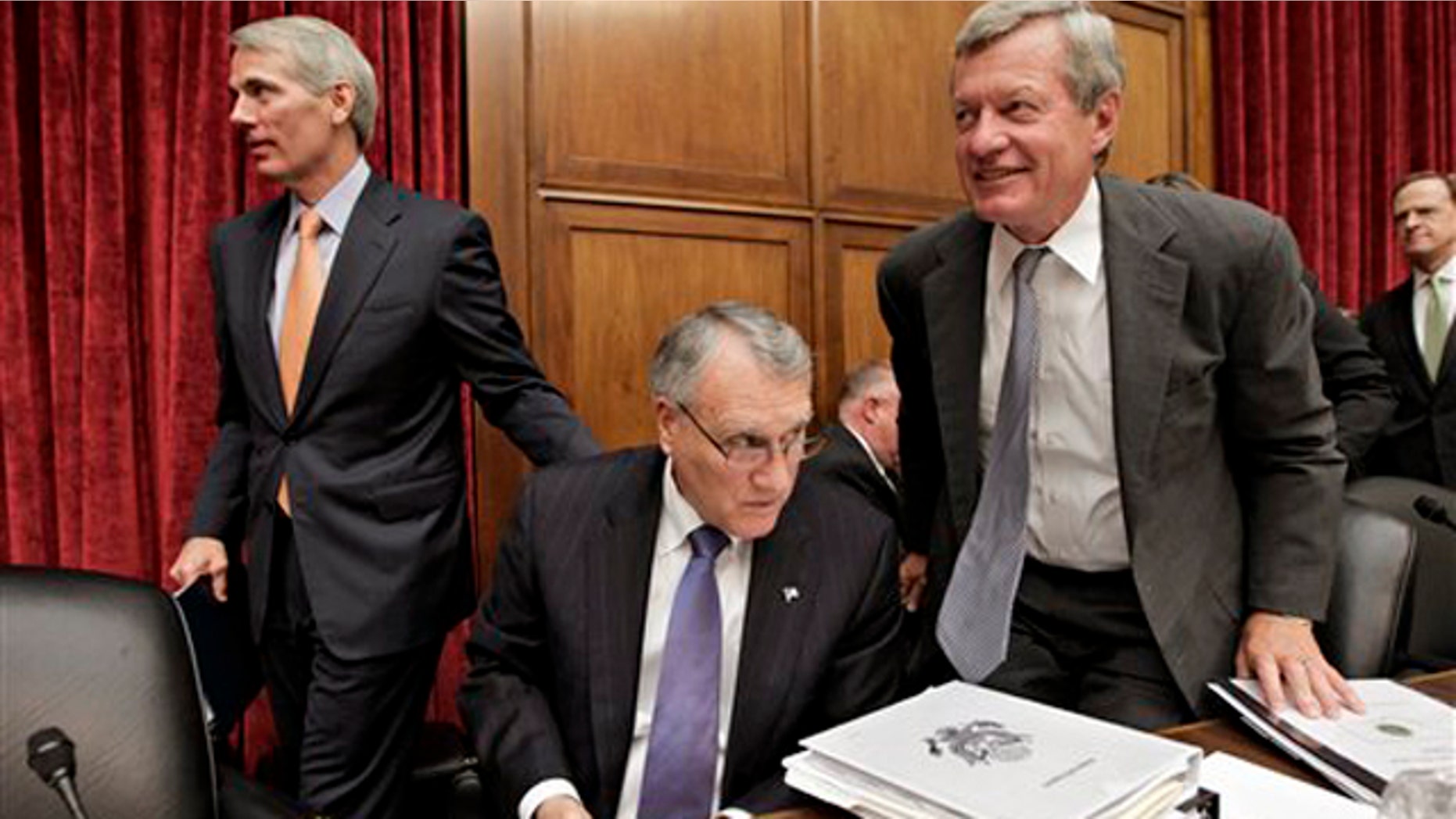 Sen. Jon Kyl, center, Sen. Max Baucus, right, and Sen. Rob Portman, left, finish with a meeting of the Joint Select Committee on Deficit Reduction on Capitol Hill in Washington Sept. 8.