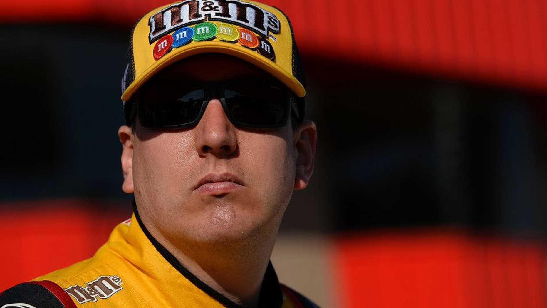 FONTANA, CA - MARCH 18: Kyle Busch, driver of the #18 M&M's 75 Toyota, stands on the grid during qualifying for the NASCAR Sprint Cup Series Auto Club 400 at Auto Club Speedway on March 18, 2016 in Fontana, California. (Photo by Robert Laberge/Getty Images)