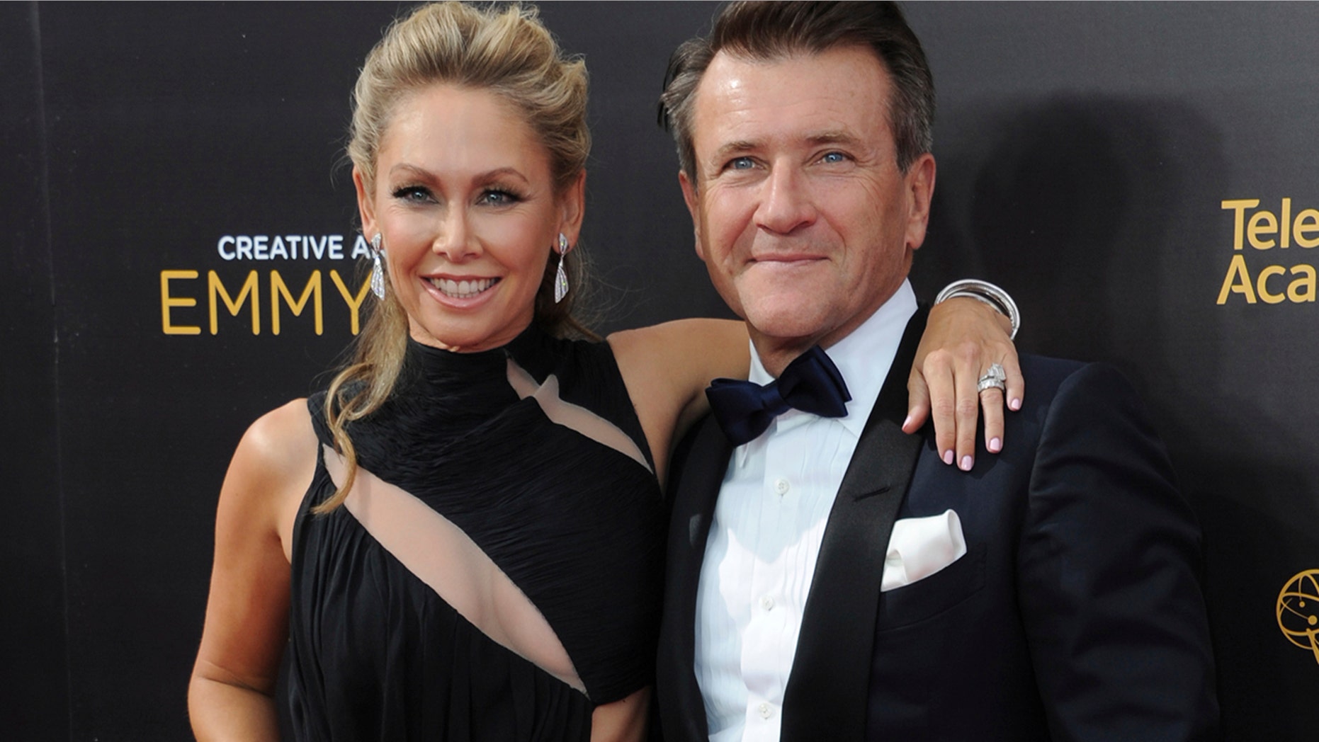 In this Sept. 11, 2016, file photo, Kym Johnson, left, and Robert Herjavec arrive at night two of the Creative Arts Emmy Awards at the Microsoft Theater in Los Angeles. Johnson and Herjavec revealed on Instagram that they welcomed twins into the world on Monday, April 23, 2018.