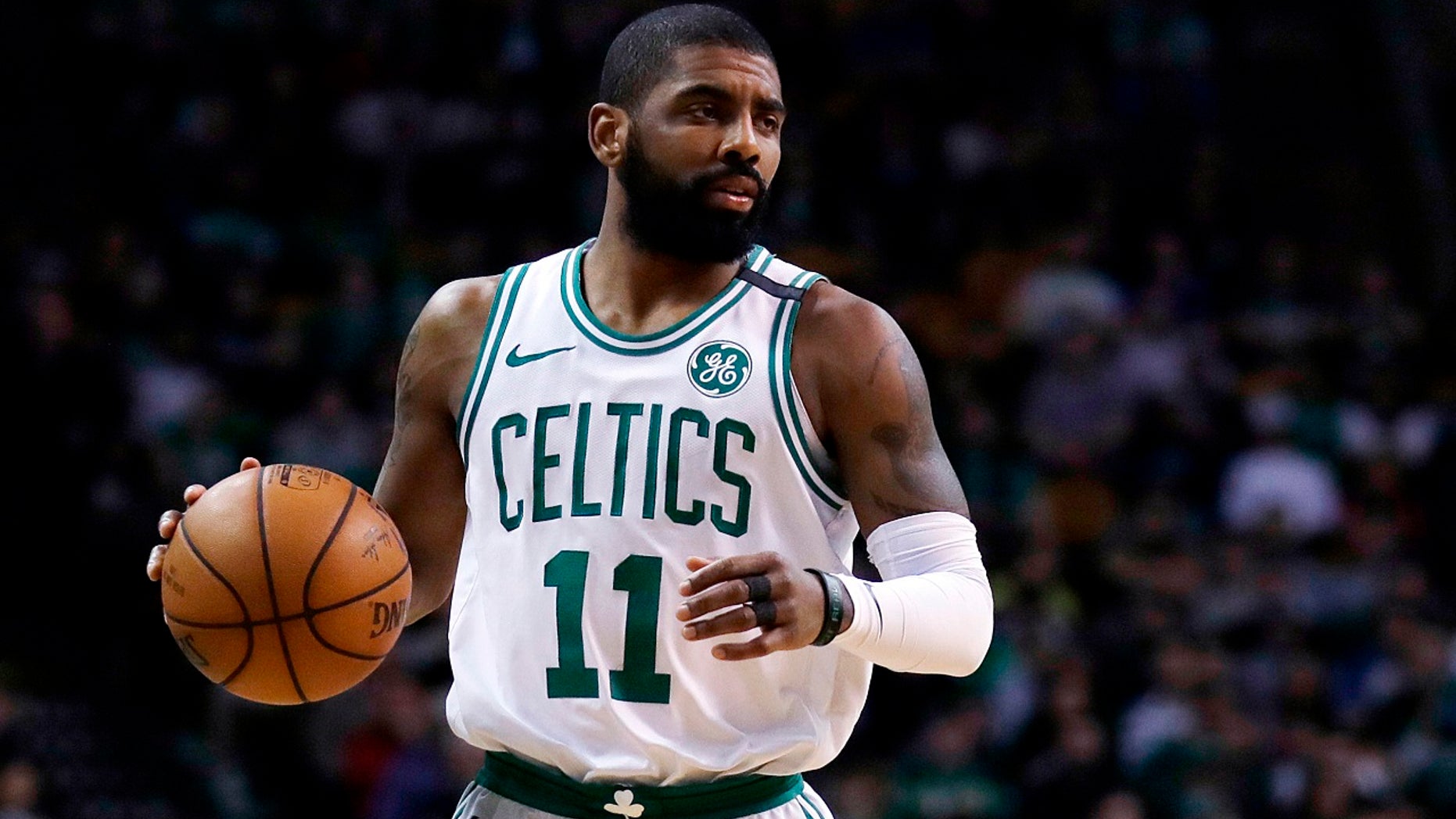 Boston Celtics guard Kyrie Irving (11) moves down court during the first quarter of an NBA basketball game in Boston, Feb 28, 2018.