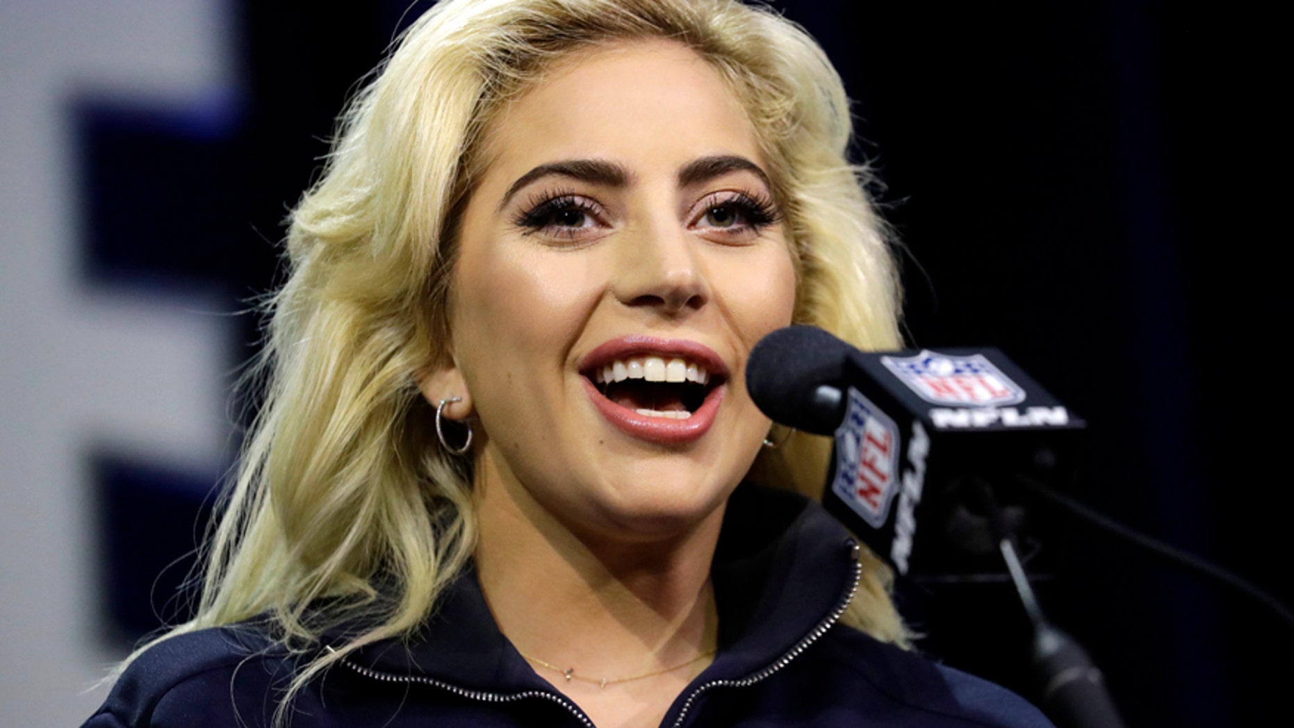 Lady Gaga answers questions at a news conference for the NFL Super Bowl 51 football game Thursday, Feb. 2, 2017, in Houston.