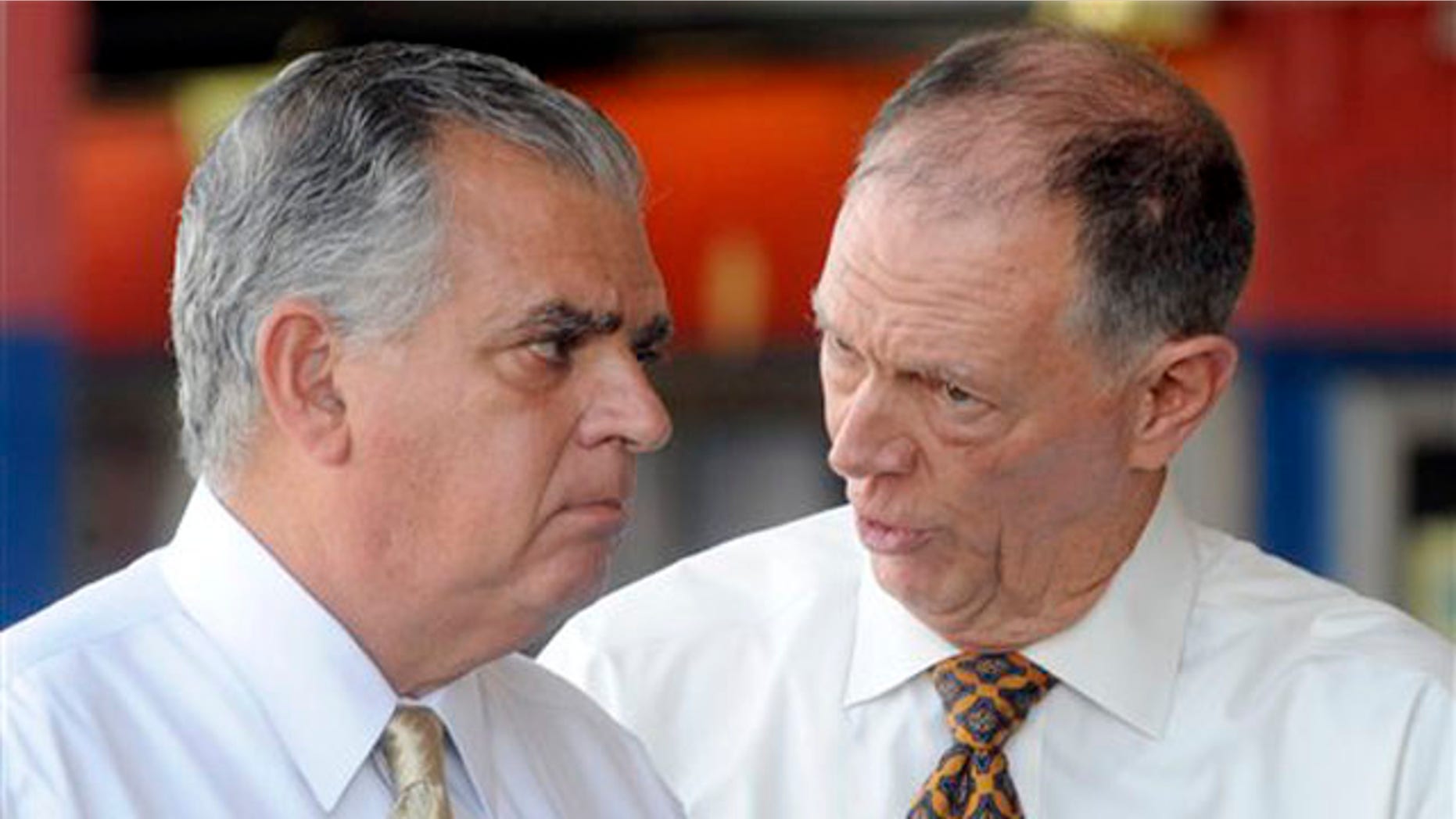 Transportation Secretary Ray LaHood, left, talks to FAA Administrator Randy Babbitt during a news conference to discuss the interruption of FAA funding in New York Aug. 1.