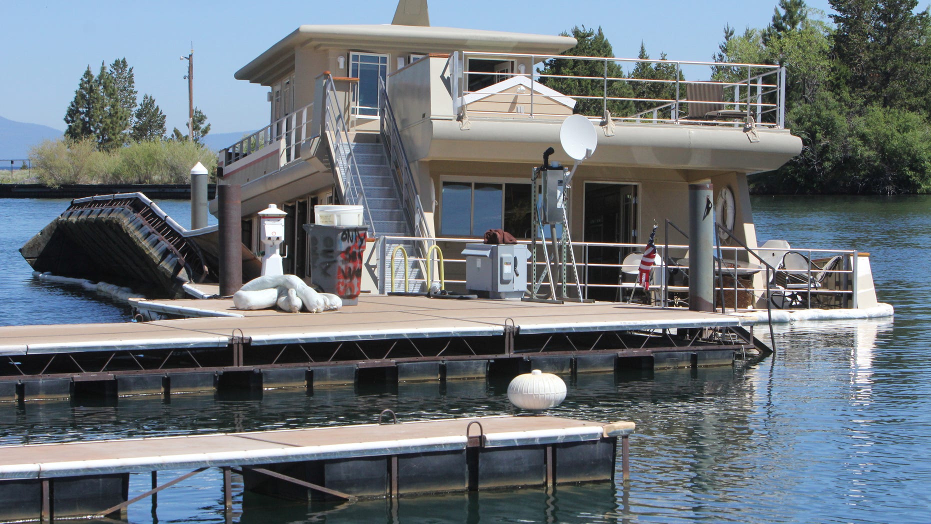 July 9, 2012: The luxury yacht the Sierra Rose, sits partially submerged at its Tahoe Keys Marina dock in South Lake Tahoe, Calif. Witnesses say the three-story yacht that recently sold for $3.2 million sunk in a Lake Tahoe marina.
