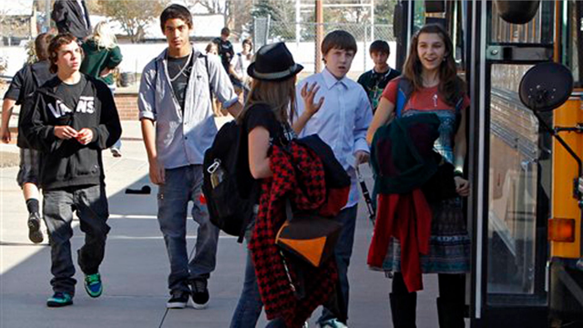 Oct. 28, 2011: Students at Carmody Middle School board buses after school in Lakewood, Colo. The only statewide tax vote on the ballot in the Nov. 2 election asked voters to pay more tax to support the school system.