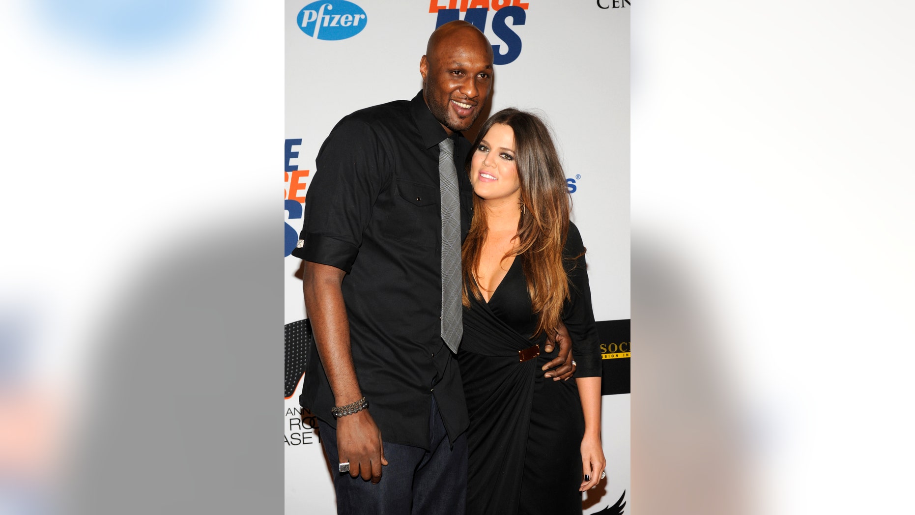 Lamar Odom (L), basketball player with the Dallas Mavericks of the NBA, and his wife Khloe Kardashian-Odom arrive for the 19th annual Race to Erase MS Gala in Los Angeles May 18, 2012. REUTERS/Phil McCarten (UNITED STATES - Tags: ENTERTAINMENT SPORT BASKETBALL) - RTR32A3E