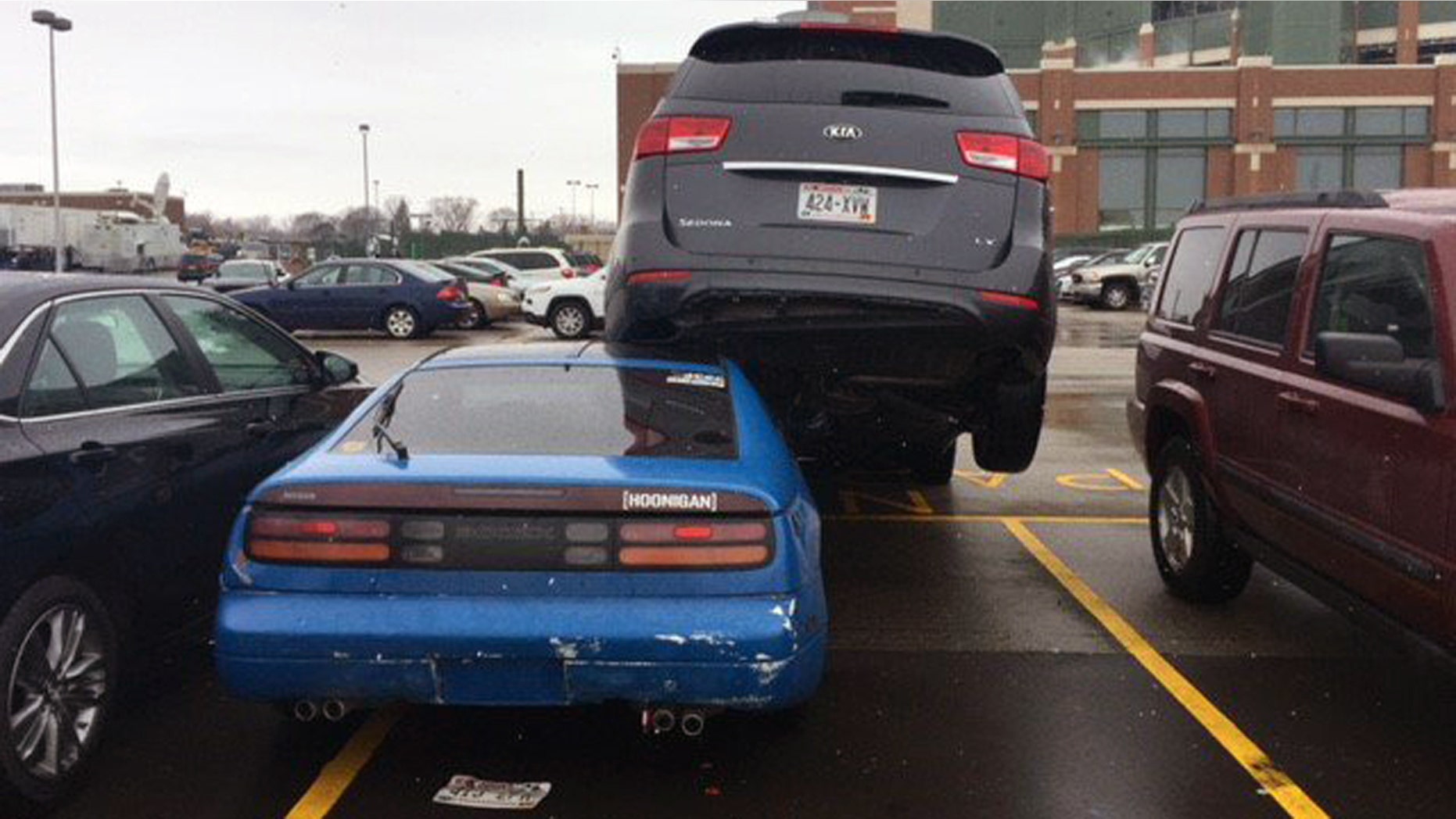 Green Bay Police say a disgruntled former food service worker drove into his ex-colleague's car, forcing it under a van in the Lambeau Field parking lot.