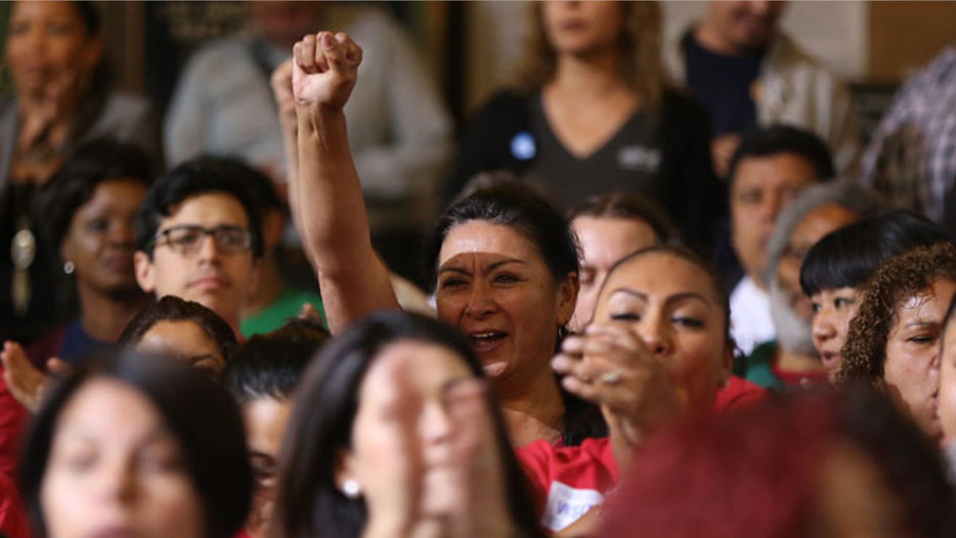May 19, 2015: Workers react as the Los Angeles City Council votes to raise the minimum wage in the city to $15 an hour by 2020, making it the largest city in the nation to do so, in Los Angeles. (AP)