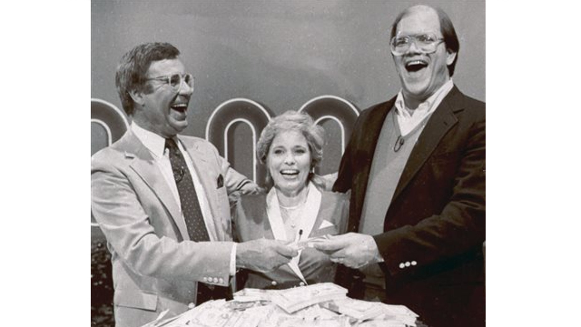 FILE: Jan. 16, 1986: Host Jim Lange, left, congratulating Connie and Steve Rutenbar of Mission Viejo, Calif., after they won $1 million on the TV show, "The $1,000,000 Chance of a Lifetime".