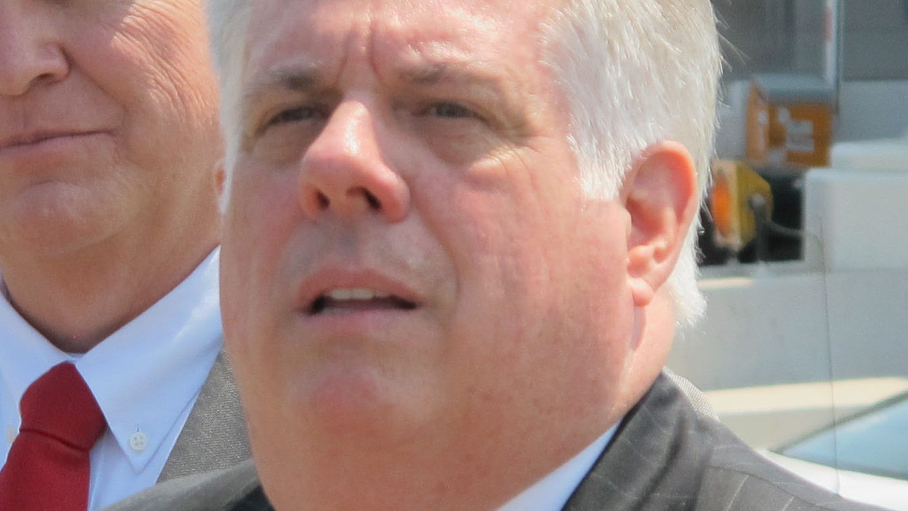 May 7, 2015: Maryland Gov. Larry Hogan, right, takes a question from a reporter.