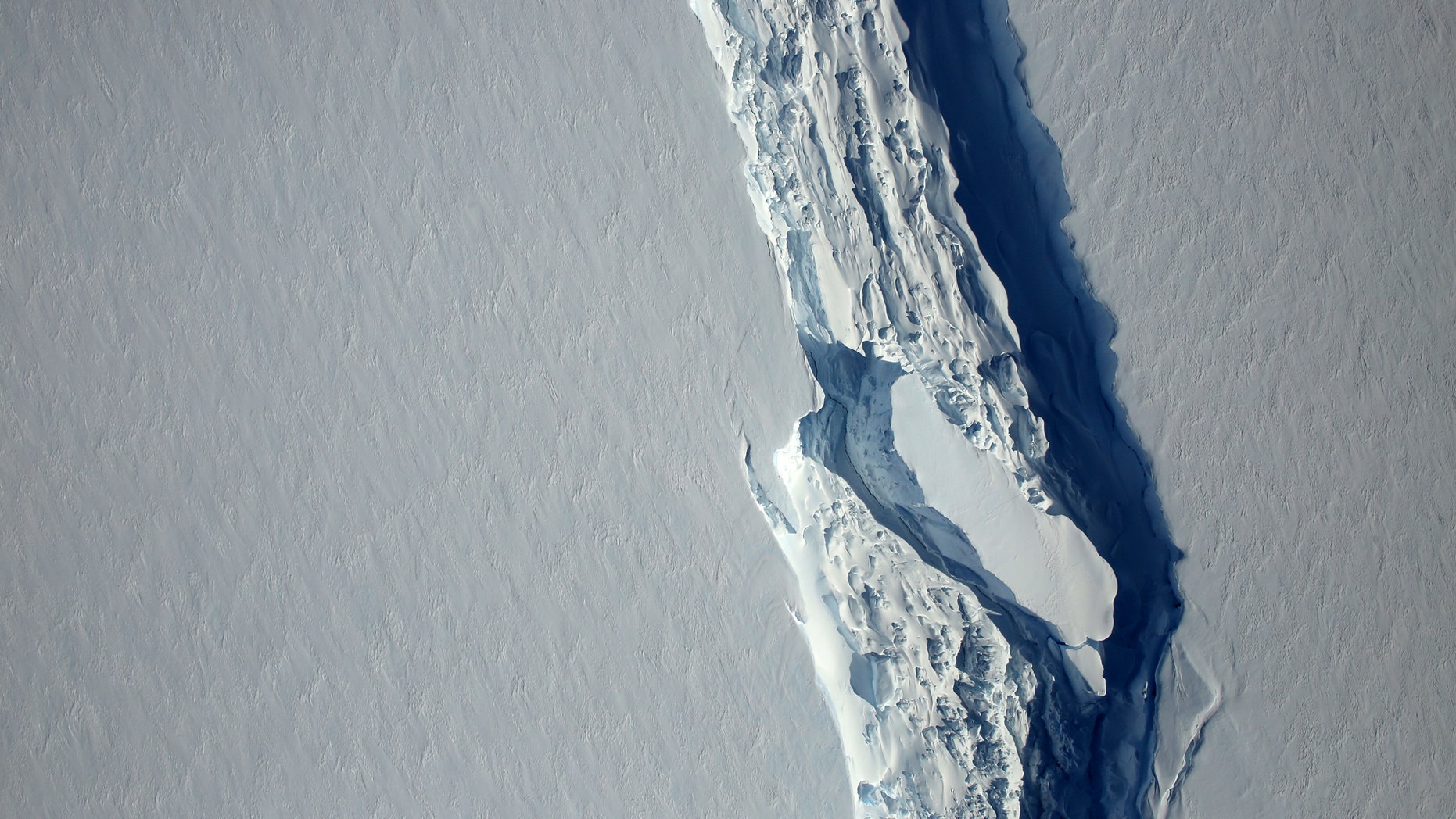 File photo - An aerial view of the rift in the Larsen C seen in an image from the Digital Mapping System over the Antarctica Peninsula, Antarctica, on November 10, 2016. (NASA's Goddard Space Flight Center/Handout via REUTERS)