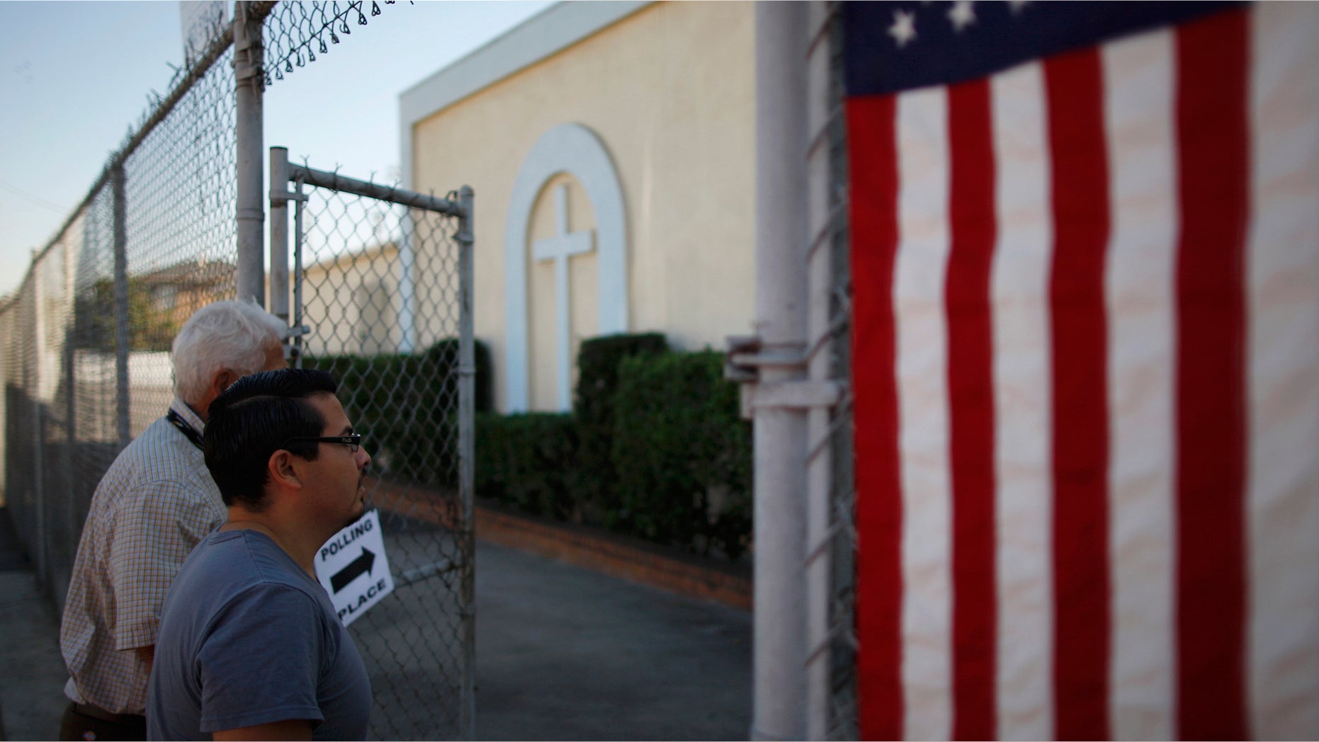 LOS ANGELES, CA - NOVEMBER 6: People enter a polling place in the heavily Latino East L.A. area during the U.S. presidential election on November 6, 2012 in Los Angeles, California. The election will decide whether Democrat Barack Obama serves a second term as president of the United States or is replaced by Republican rival, former Massachusetts Gov. Mitt Romney. (Photo by David McNew/Getty Images)