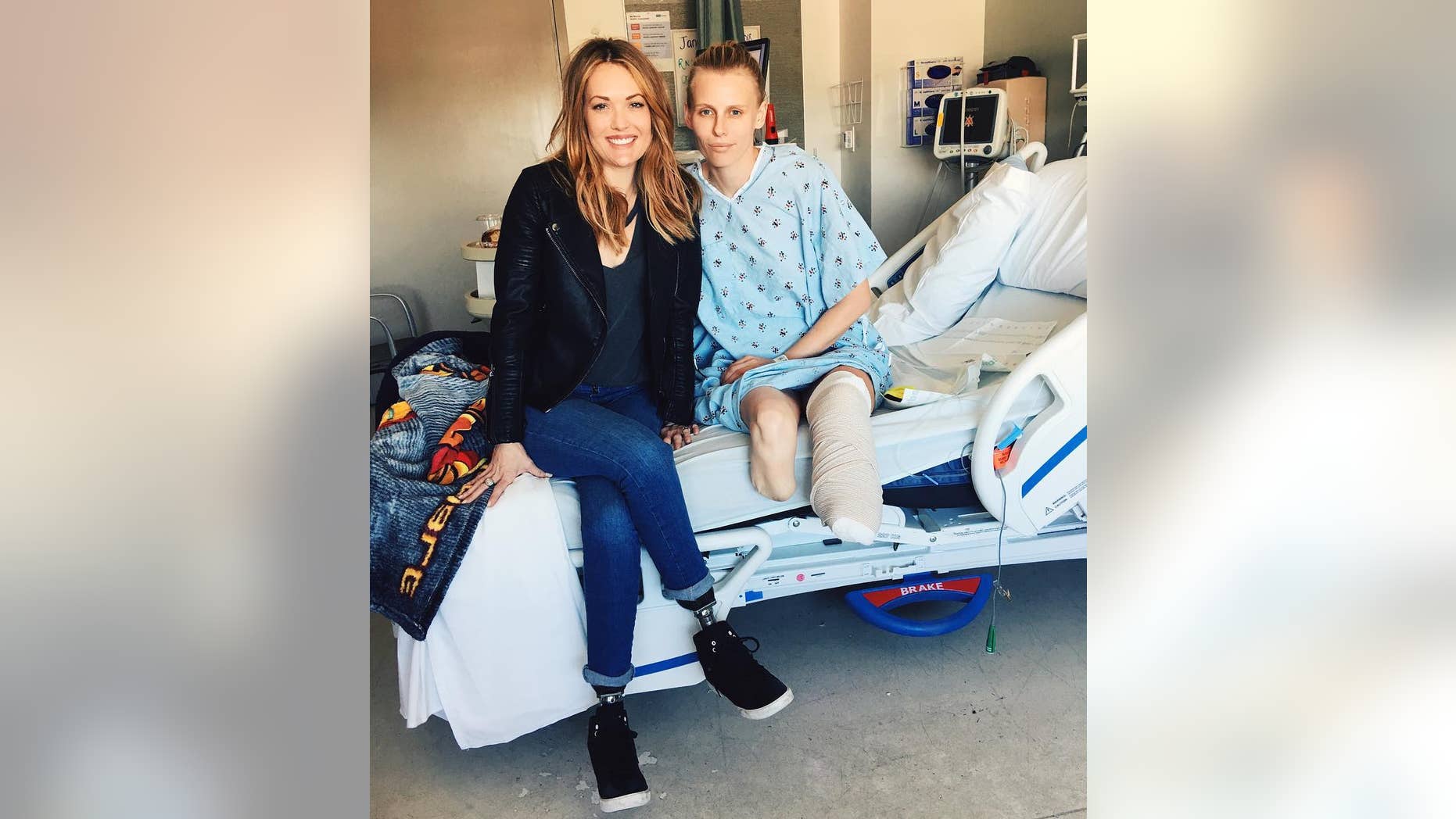 Model Lauren Wasser, right, poses with Paralympic snowboarder and double amputee Amy Purdy.