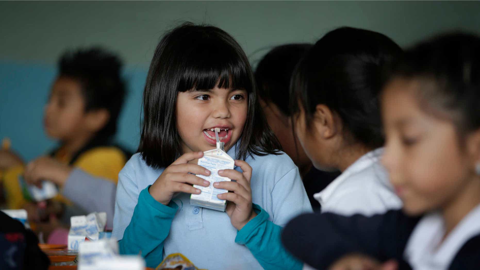 Jan. 13, 2015: Hazel Loarca, 7, drinks her milk in the cafeteria area at Kingsley Elementary School