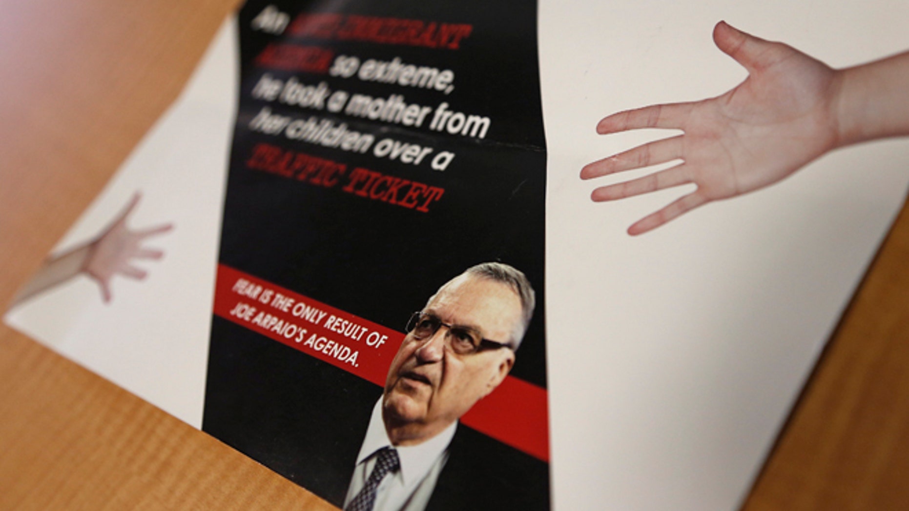 A group backed by the New York hedge fund billionaire George Soros, a longtime bankroller of liberal political causes, is mailing anti-Joe Arpaio fliers to Phoenix-area voters shown here, Tuesday, Sept. 13, 2016, in Phoenix.