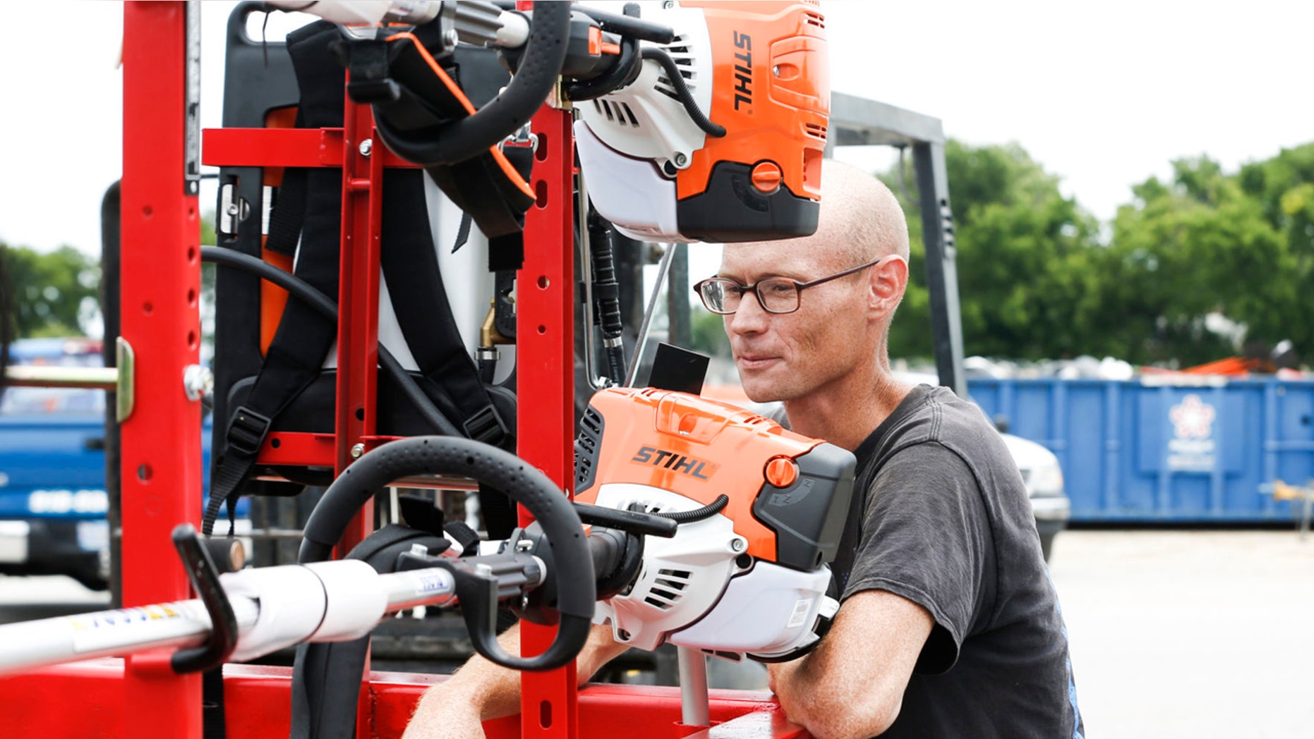 Cody Nichols appraises the new equipment he received from Soldier's Wish at Bloss Equipment in Tulsa, Okla., on Friday, June 22, 2018.