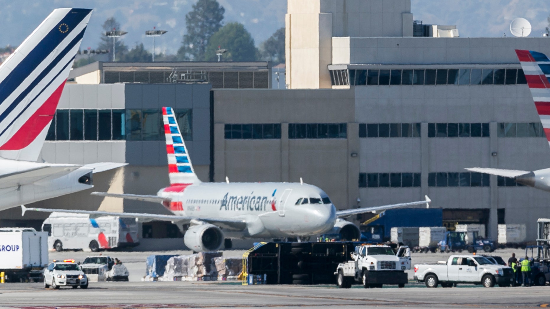 An airport utility truck is seen overturned after an Aeromexico flight clipped the truck, flipping it over, shortly after landing at Los Angeles International Airport Saturday, May 20, 2017.