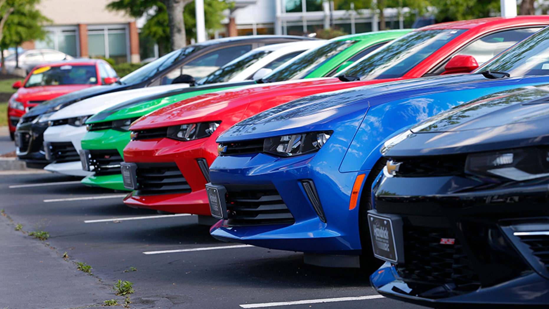 In this Wednesday, April 26, 2017, photo, Chevrolet Camaros are lined up in the lot of a Chevrolet dealership in Richmond, Va. As the end of your car lease approaches, you may start to see every scratch, stain and extra mile as another dollar coming out of your pocket. But by learning how the lease-ending process works, and what damage youâre likely to be charged for, you can avoid excess wear and tear on your wallet. (AP Photo/Steve Helber)